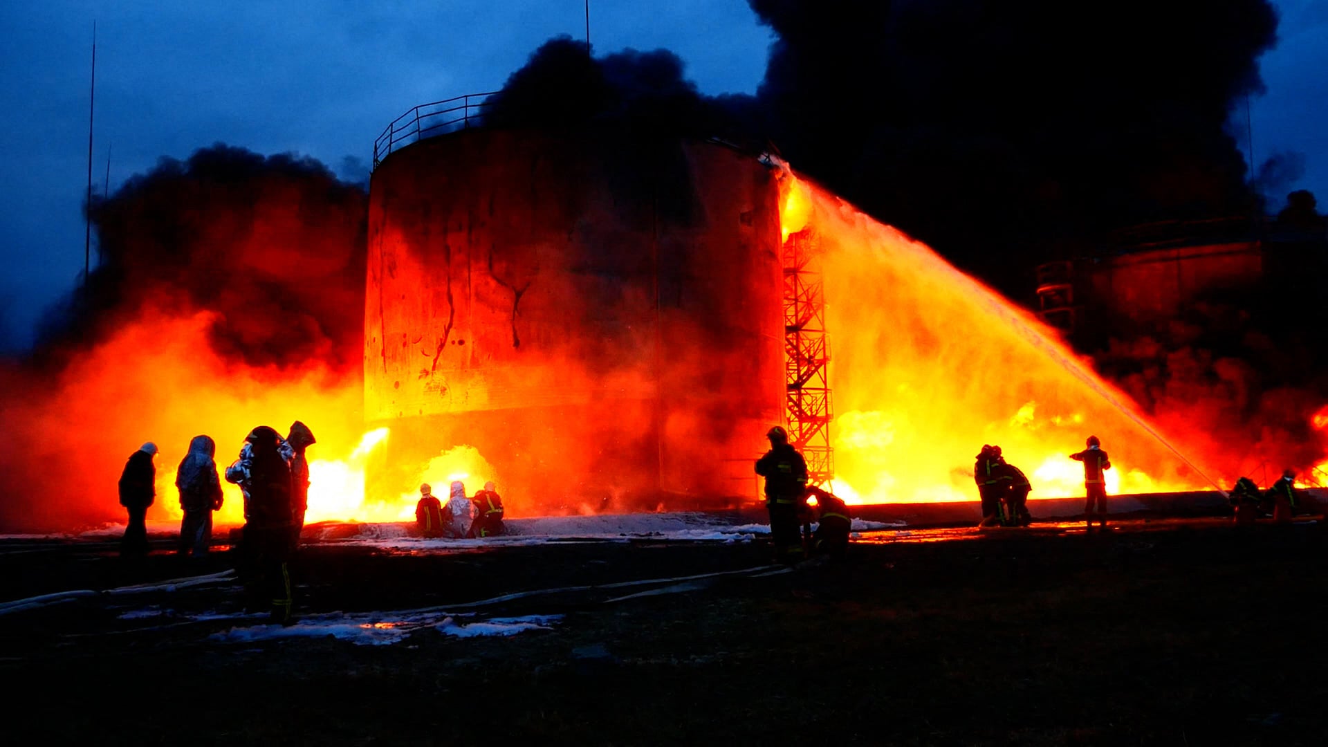 Firefighters deal with the aftermath of a strike on a fuel storage facility in Lviv on Saturday