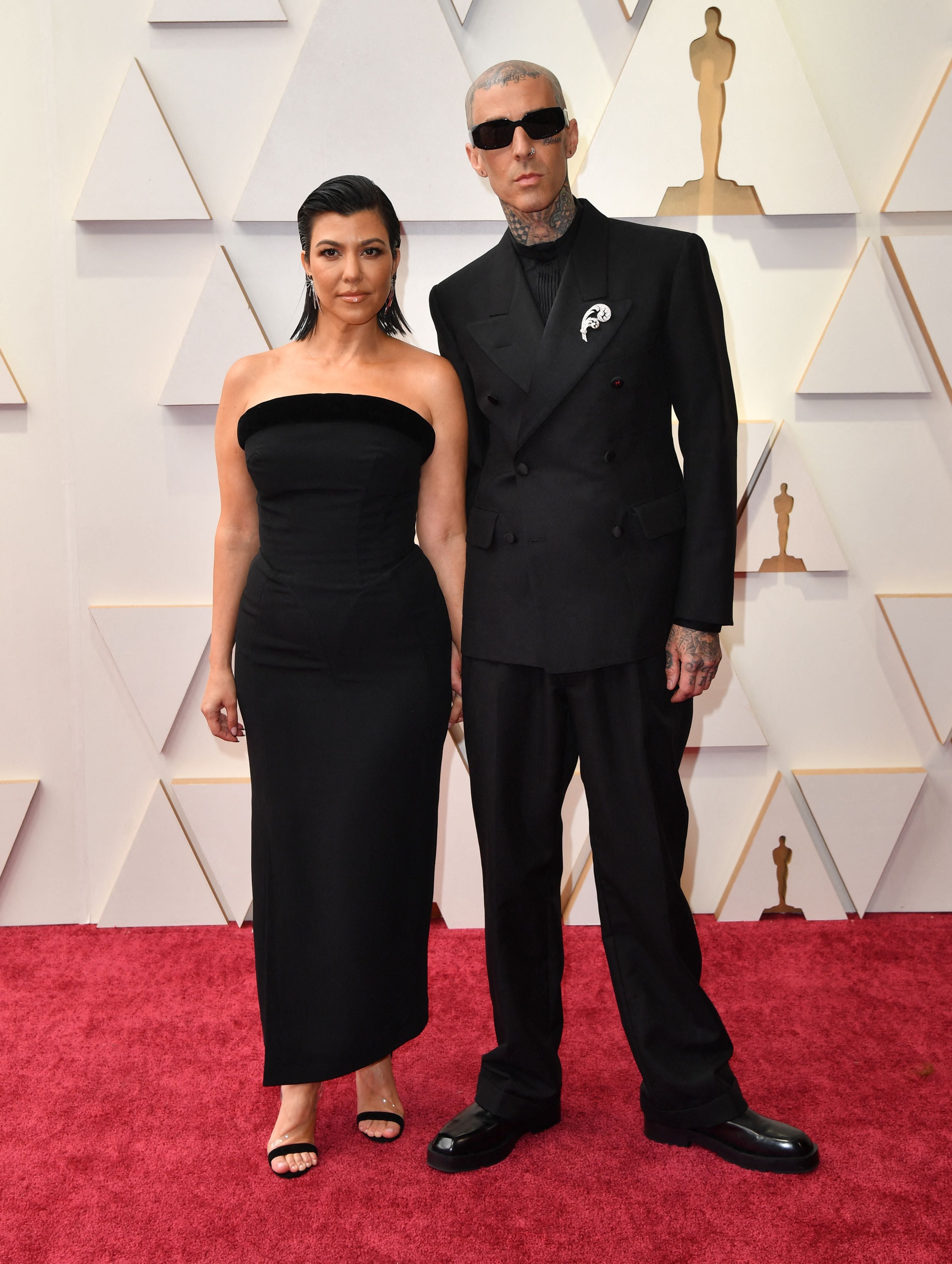 Kourtney Kardashian and Travis Barker attend the Oscars 2022