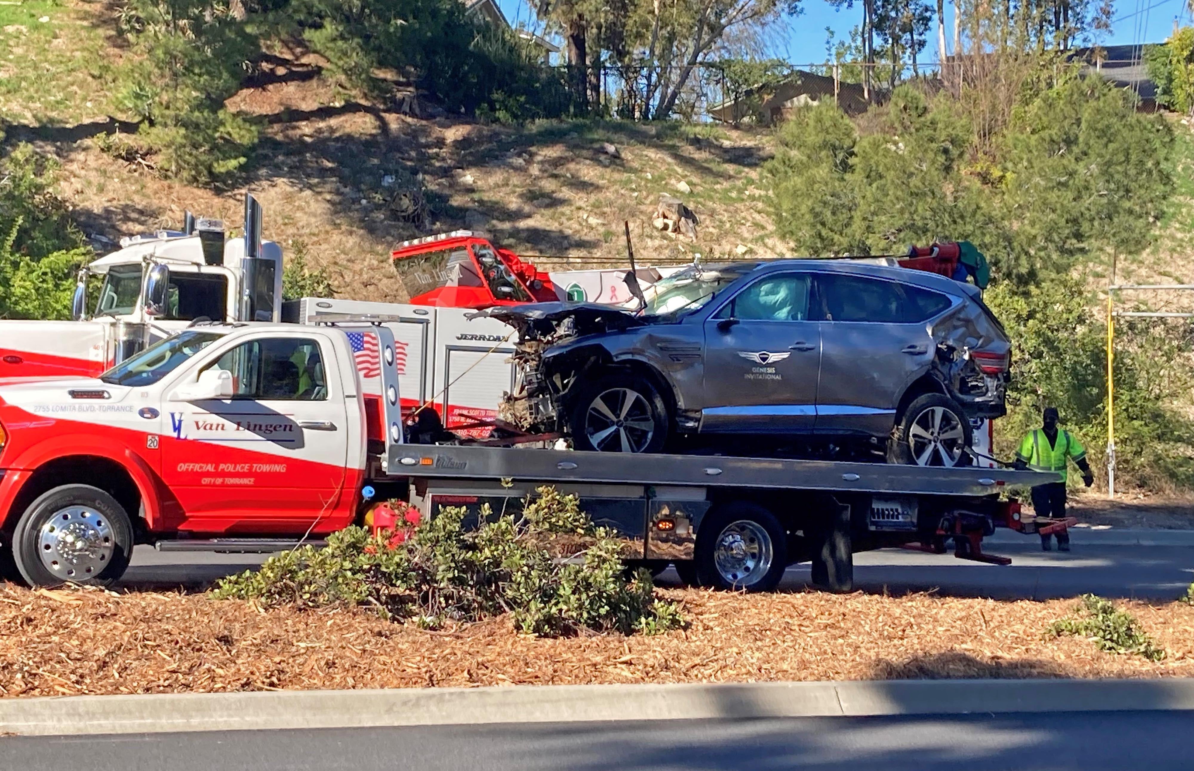 The vehicle driven by Tiger Woods on the back of a truck in Los Angeles after he suffered serious leg injuries in a single-vehicle accident in Los Angeles (Keiran Southern/PA)