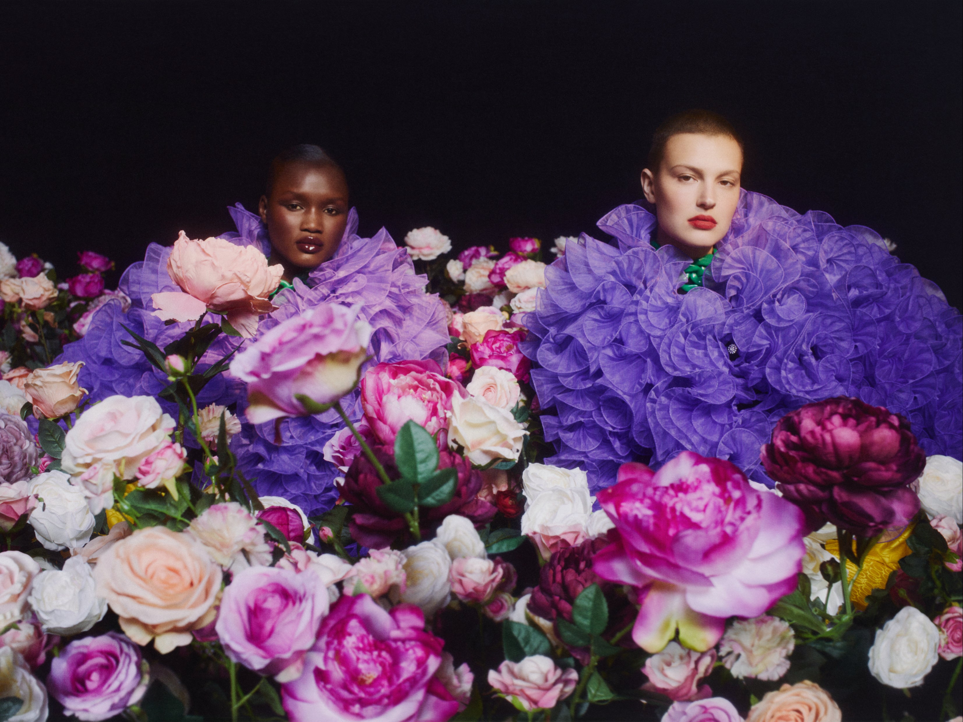 Models wear a violet tulle jacket from the collection