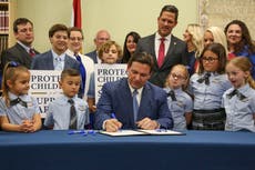 Ron DeSantis signs ‘Don’t Say Gay’ bill into law during staged ceremony surrounded by children