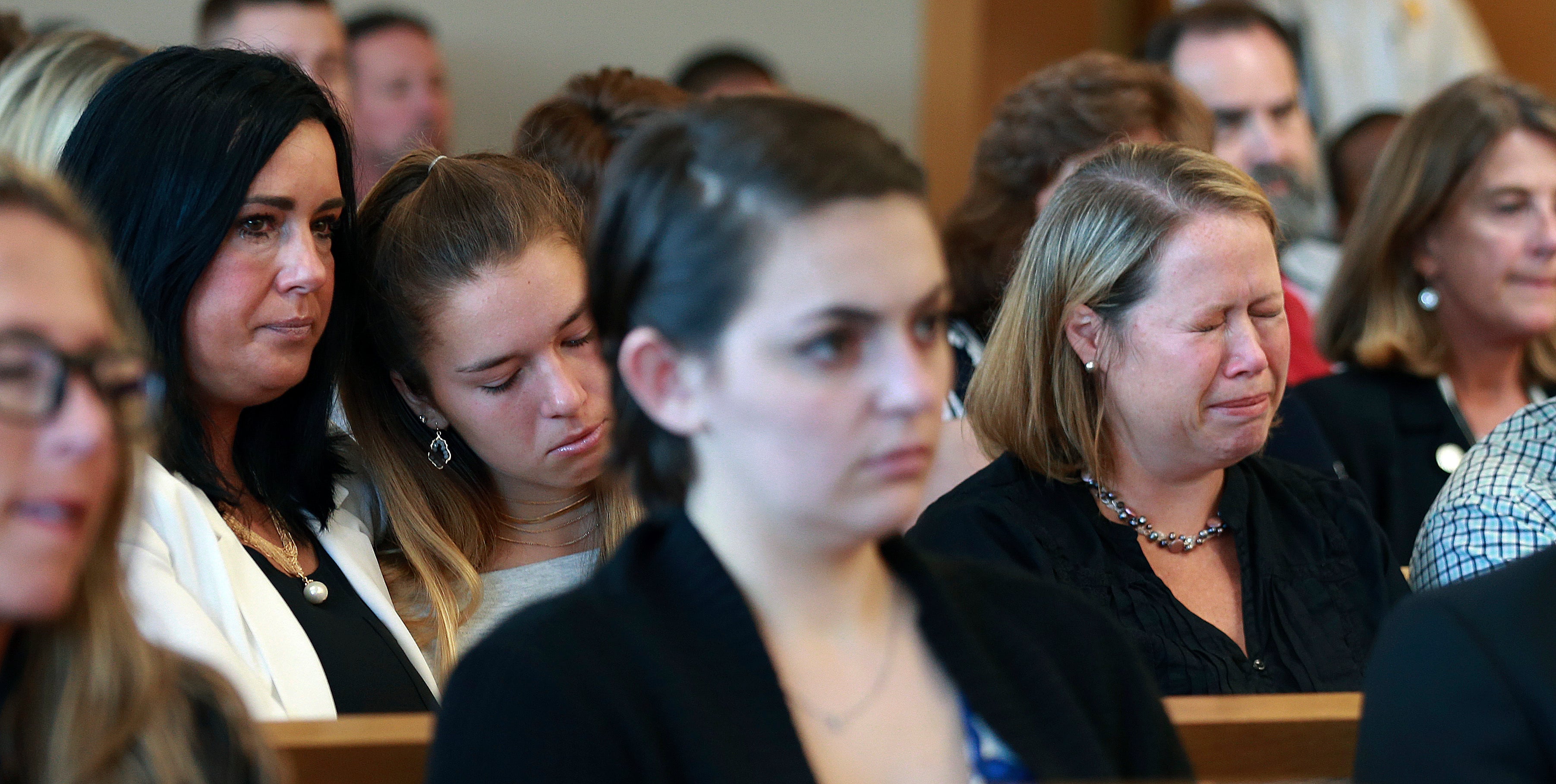 Conrad Roy III’s mother Lynn (right) cries as her then-husband Conrad Roy Jr reads his victim impact statement in court