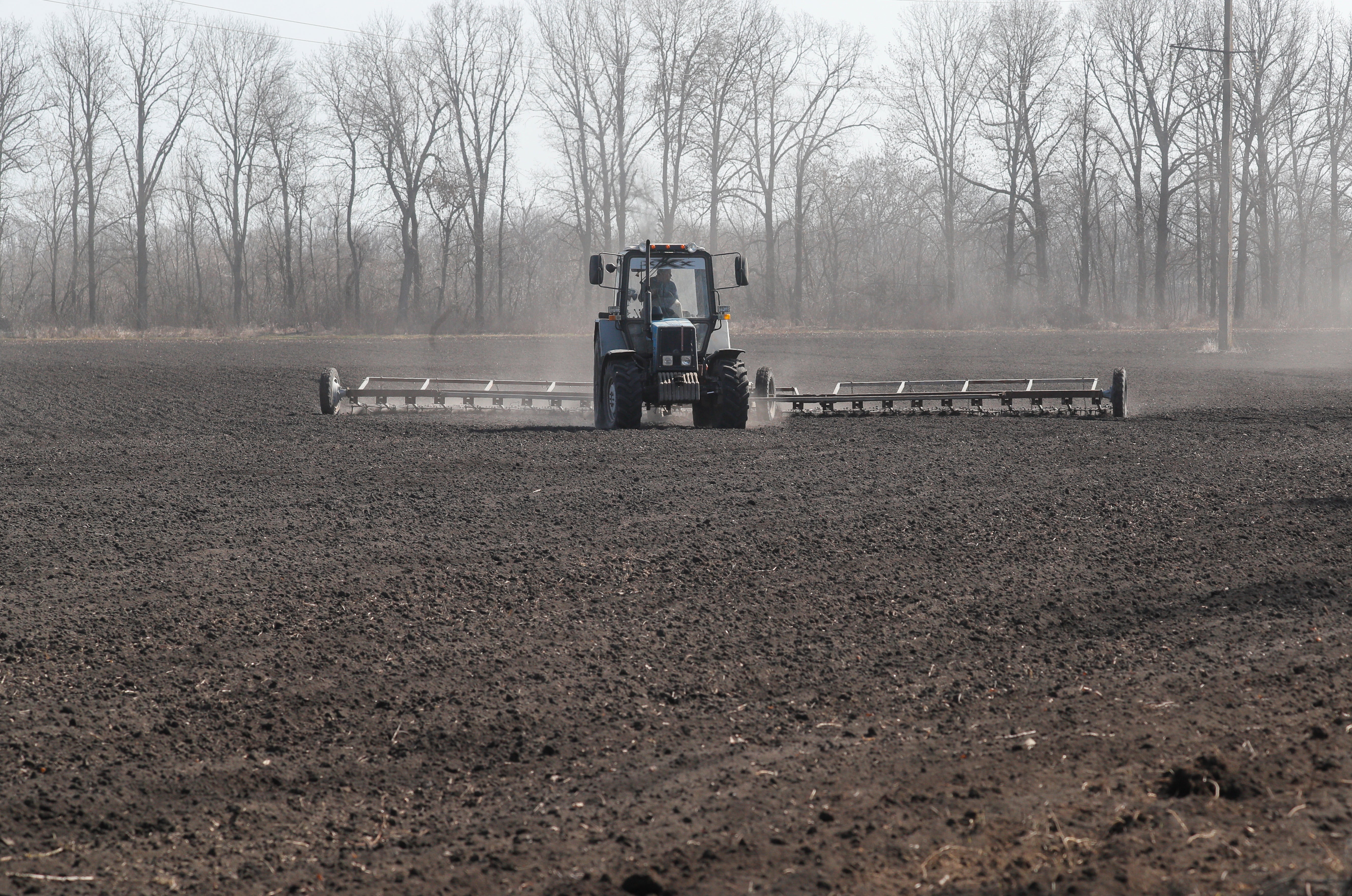 Farmers harrow soil before sowing campaign not far from Kyiv