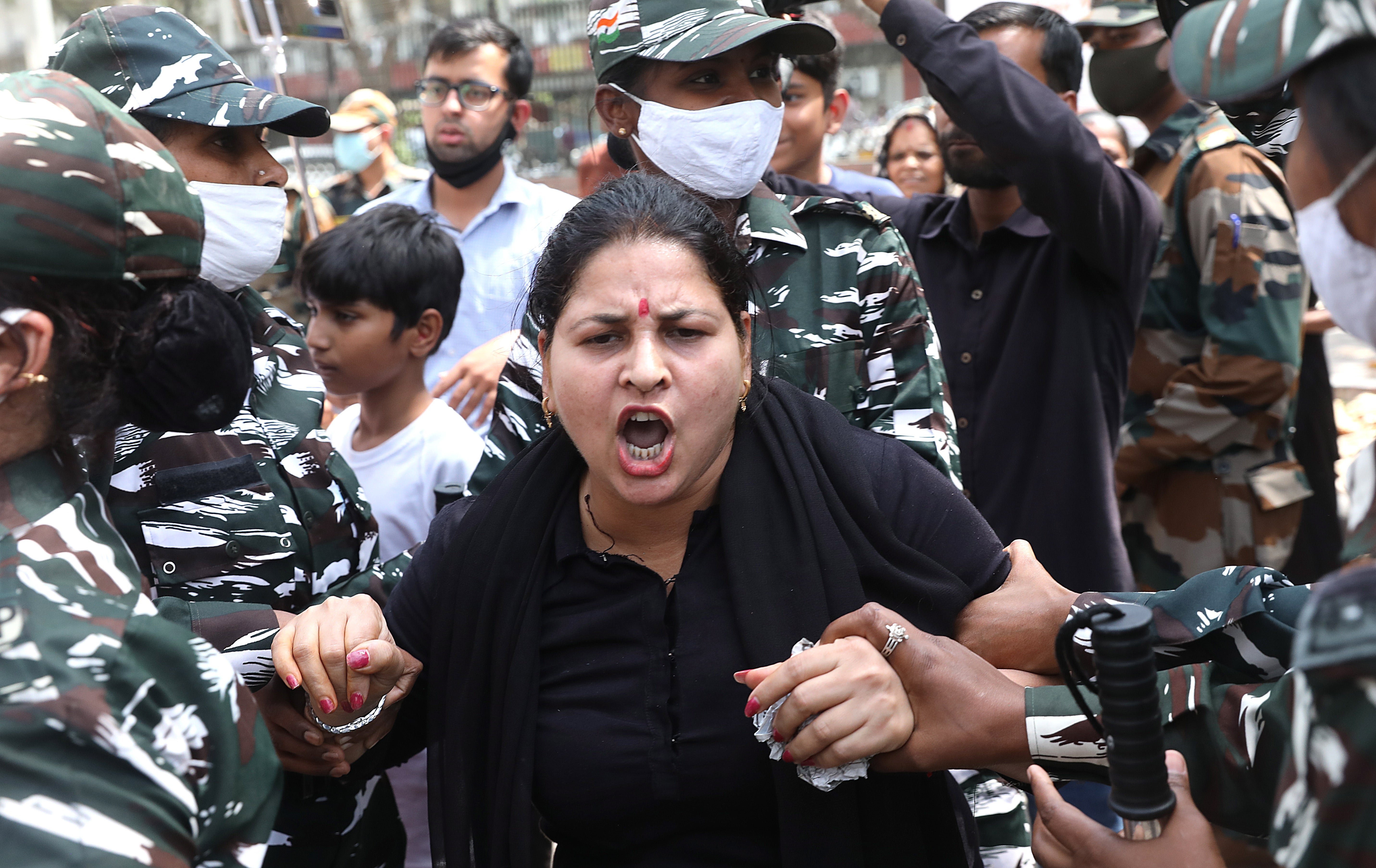 A protester being detained by paramilitary troops during second day of nationwide strike