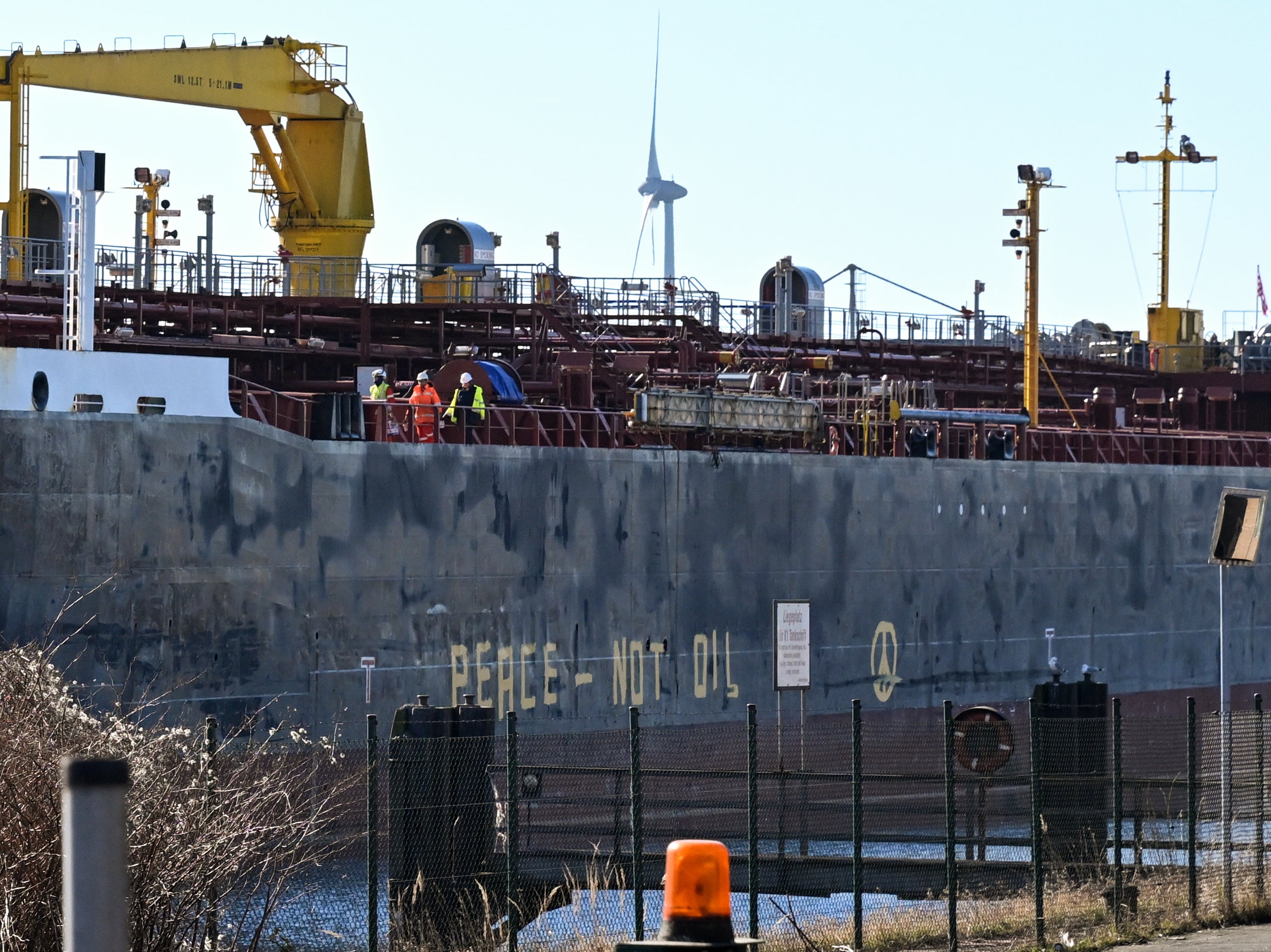 Greenpeace activists spray ‘Peace – Not Oil’ on vessel carrying Russian oil products in Germany