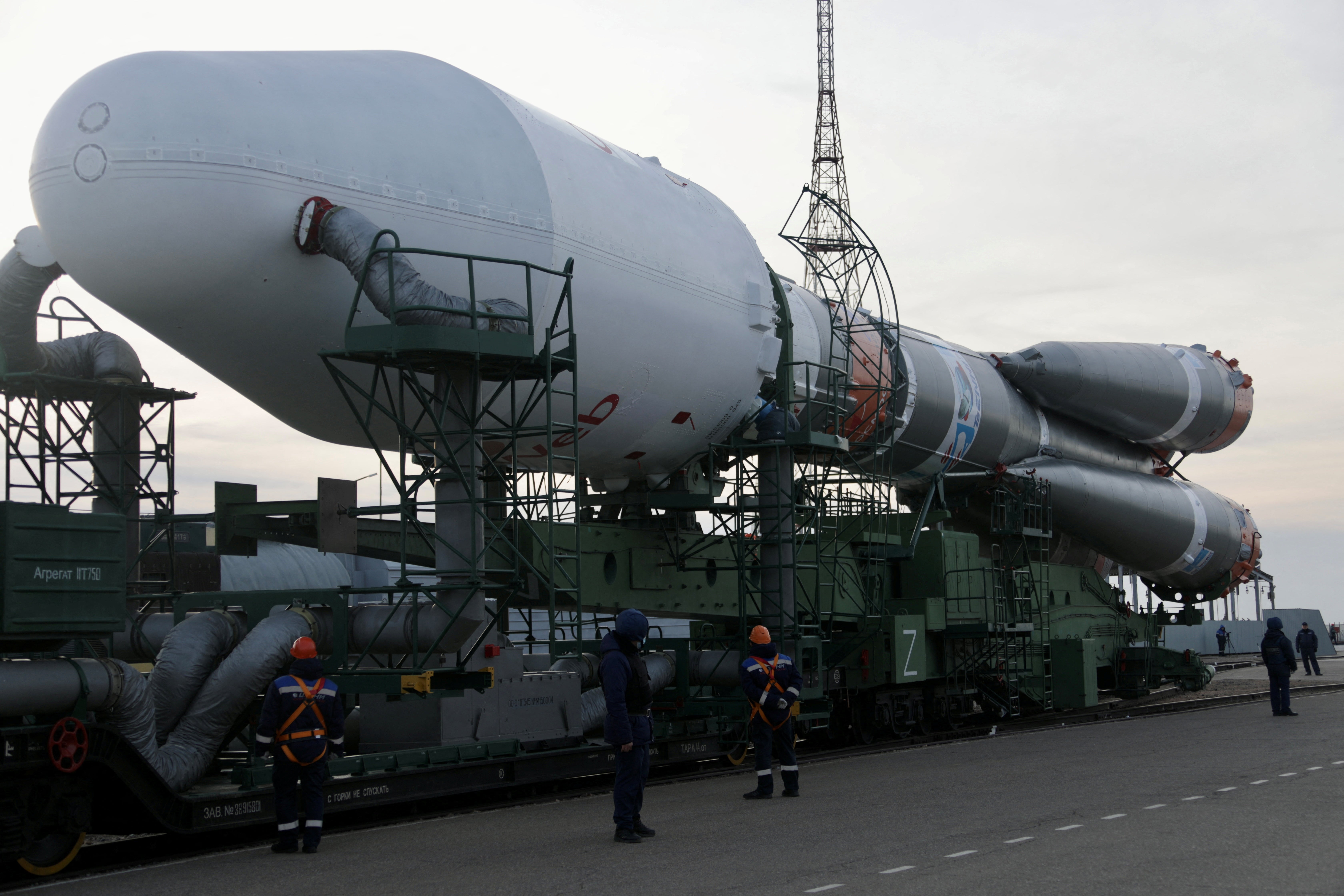 A Soyuz-2.1b rocket booster with a Fregat upper stage and satellites of British firm OneWeb is removed from a launchpad after the launch was cancelled at the Baikonur Cosmodrome in Kazakhstan