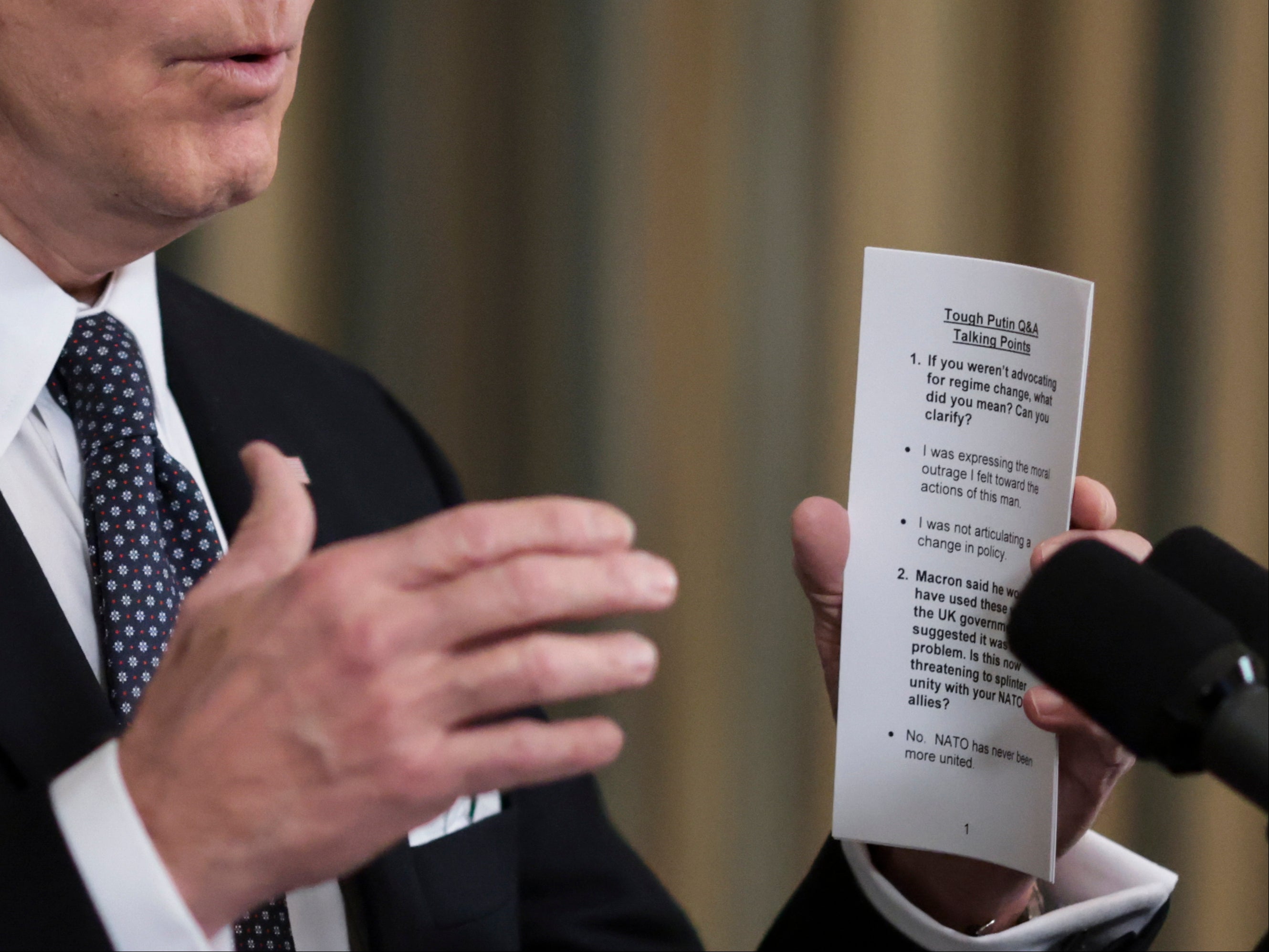 US President Joe Biden holds a note with talking points related to his comments on Putin as he announces his Budget for Fiscal Year 2023