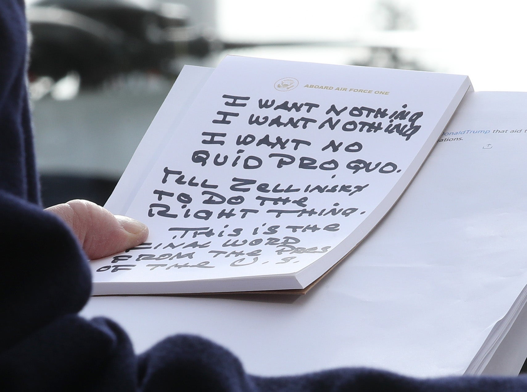 U.S. President Donald Trump holds his notes while speaking to the media before departing from the White House on November 20, 2019 in Washington, DC