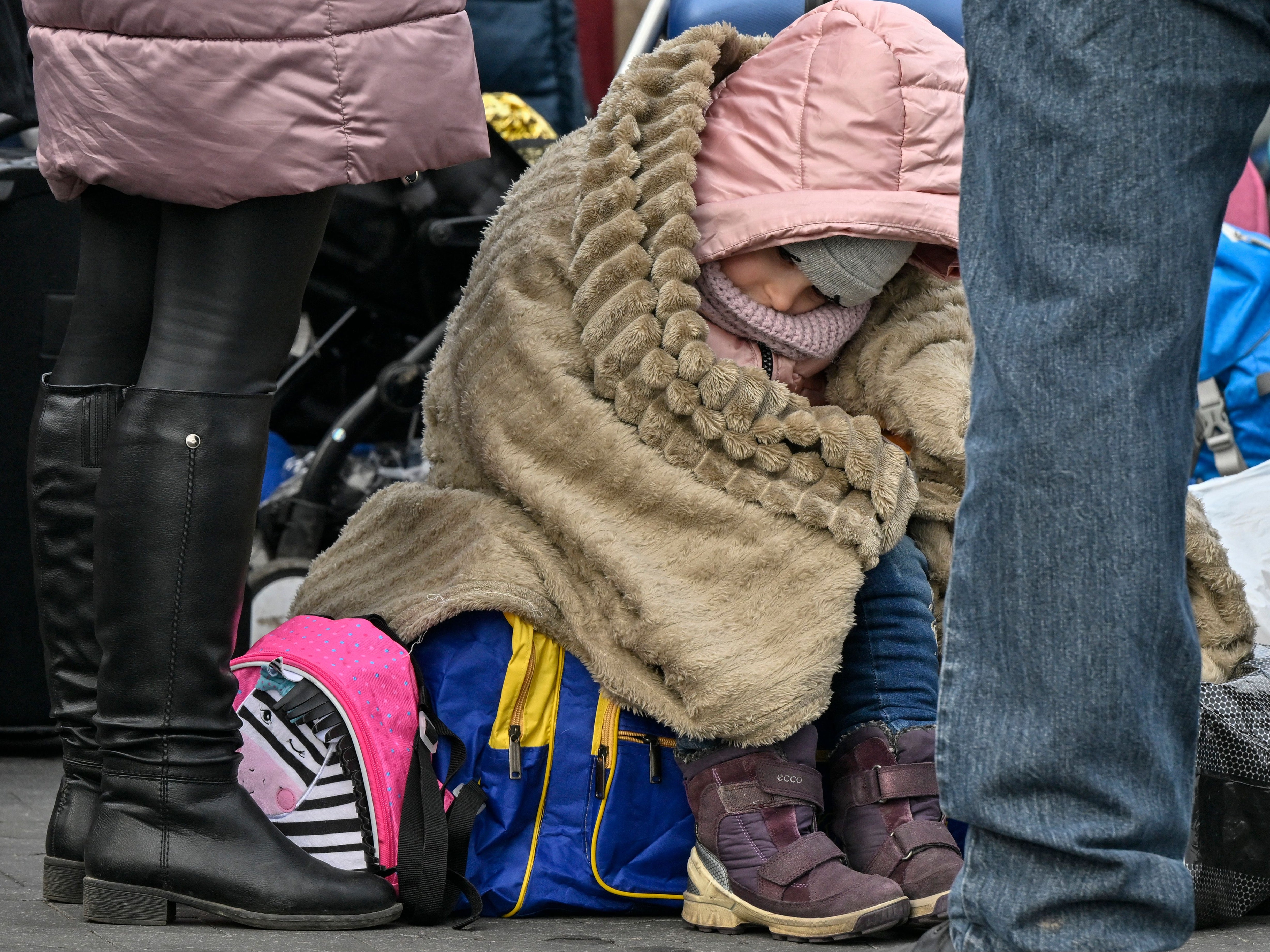 File photo: A Ukrainian child waits to be relocated from the temporary shelter in a former shopping centre between Ukraine and the Polish city of Przemysl