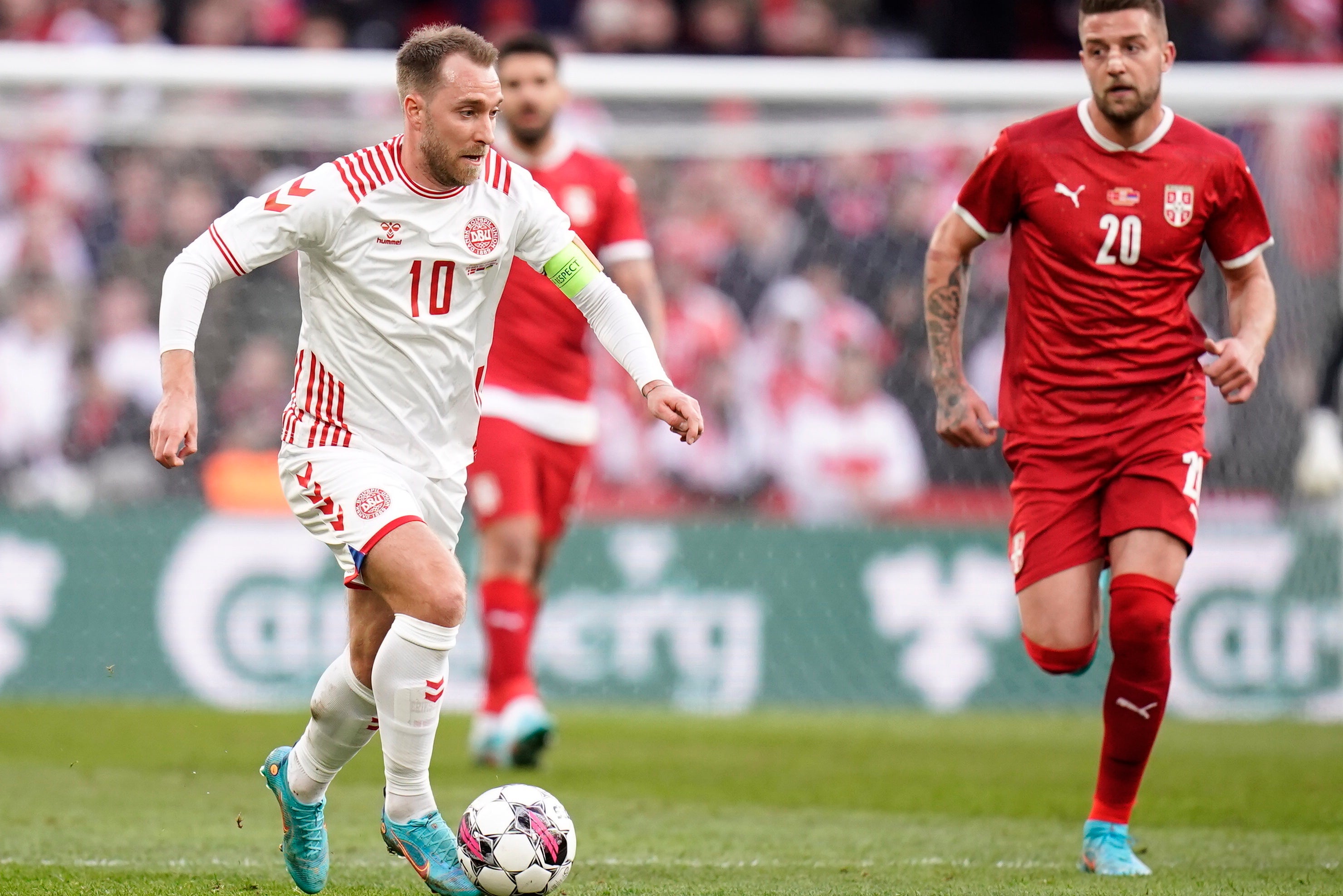 Christian Eriksen, left, captained the side on his return to action in Copenhagen (Liselotte Sabroe/Ritzau Scanpix/AP)