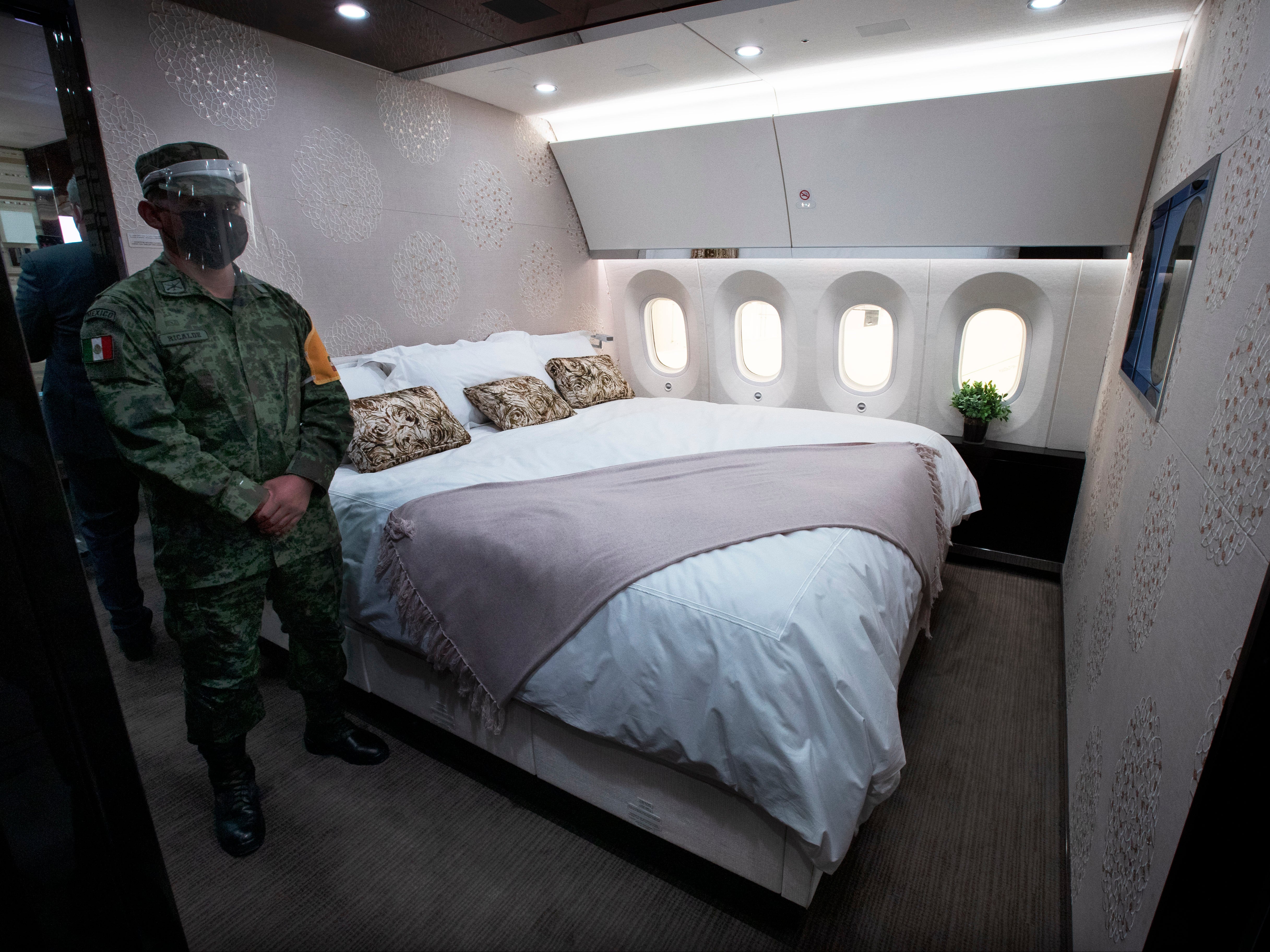 In this July 27, 2020 file photo, a soldier stands guard inside the former Mexican presidential plane during a media tour