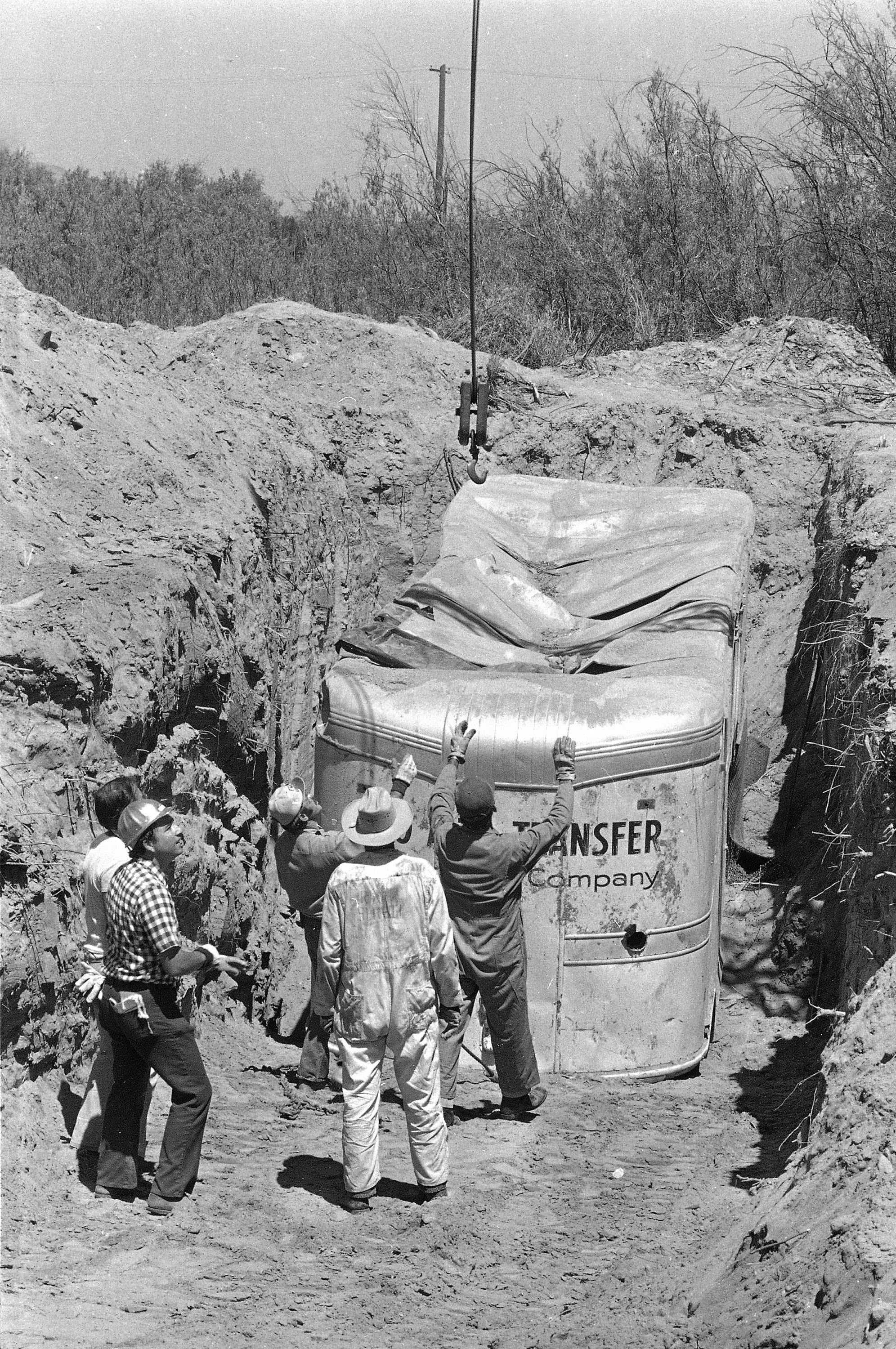 Officials remove a truck buried at a rock quarry in Livermore, California in which 26 Chowchilla school children and their bus driver, Ed Ray, were held captive