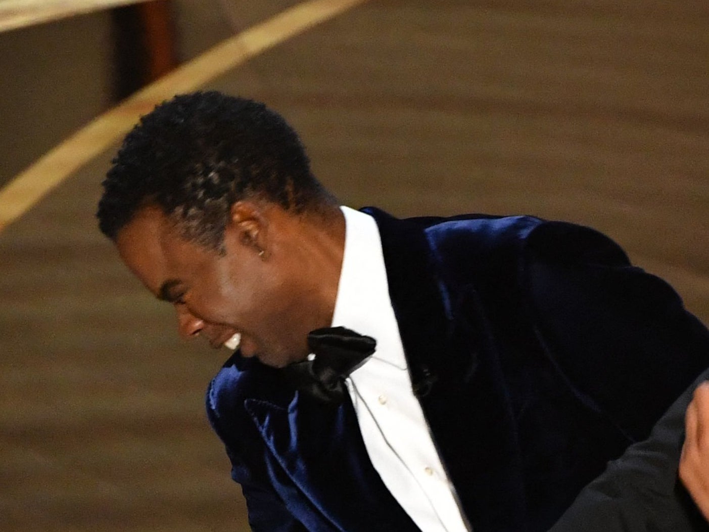 Photos captured live at the Oscars ceremony, and available on Getty, show Rock wasn’t wearing a cheek pad during the incident