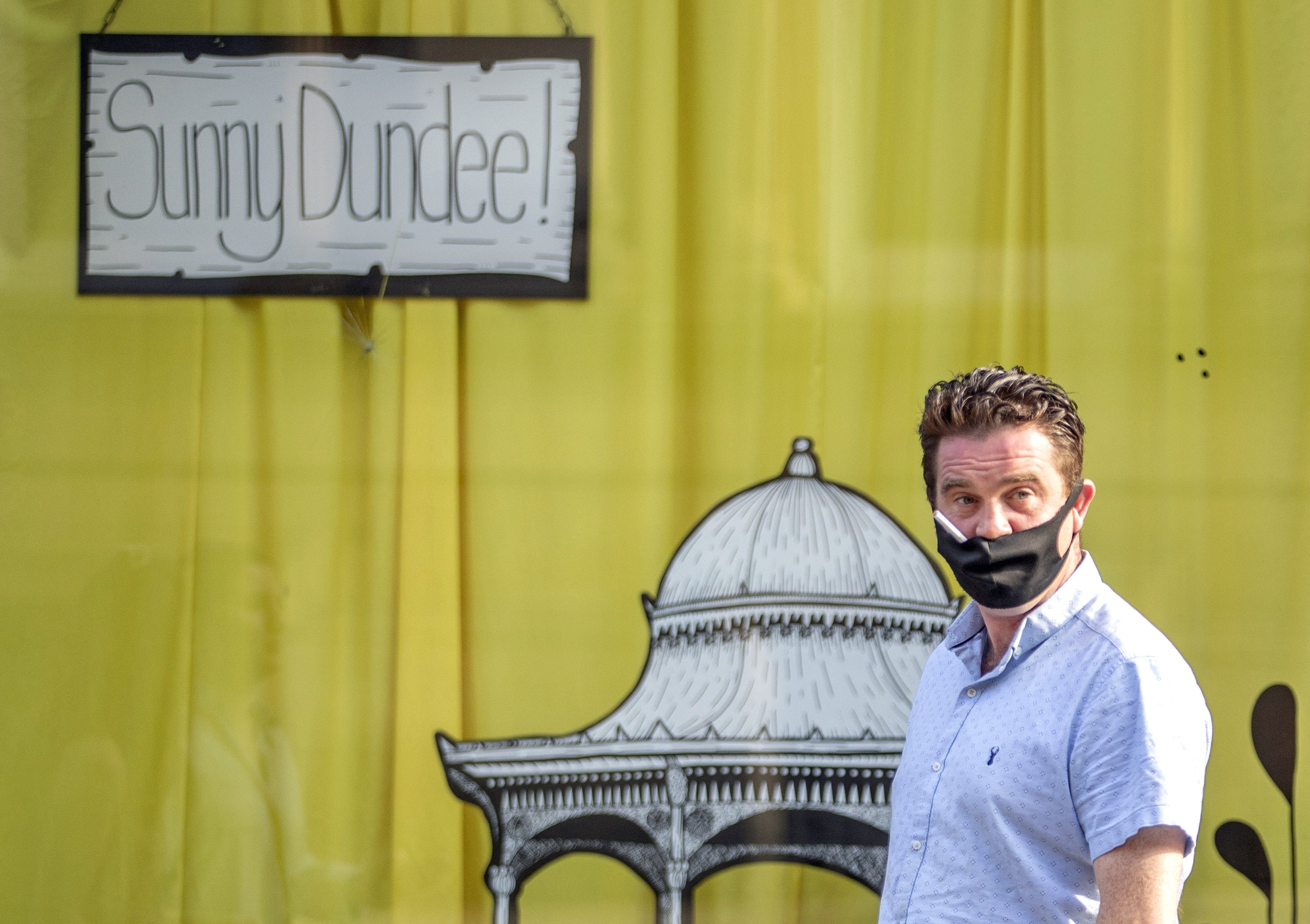 Laws requiring face coverings to be warn in Scotland are to be ended on ‘phased basis’ (Jane Barlow/PA)