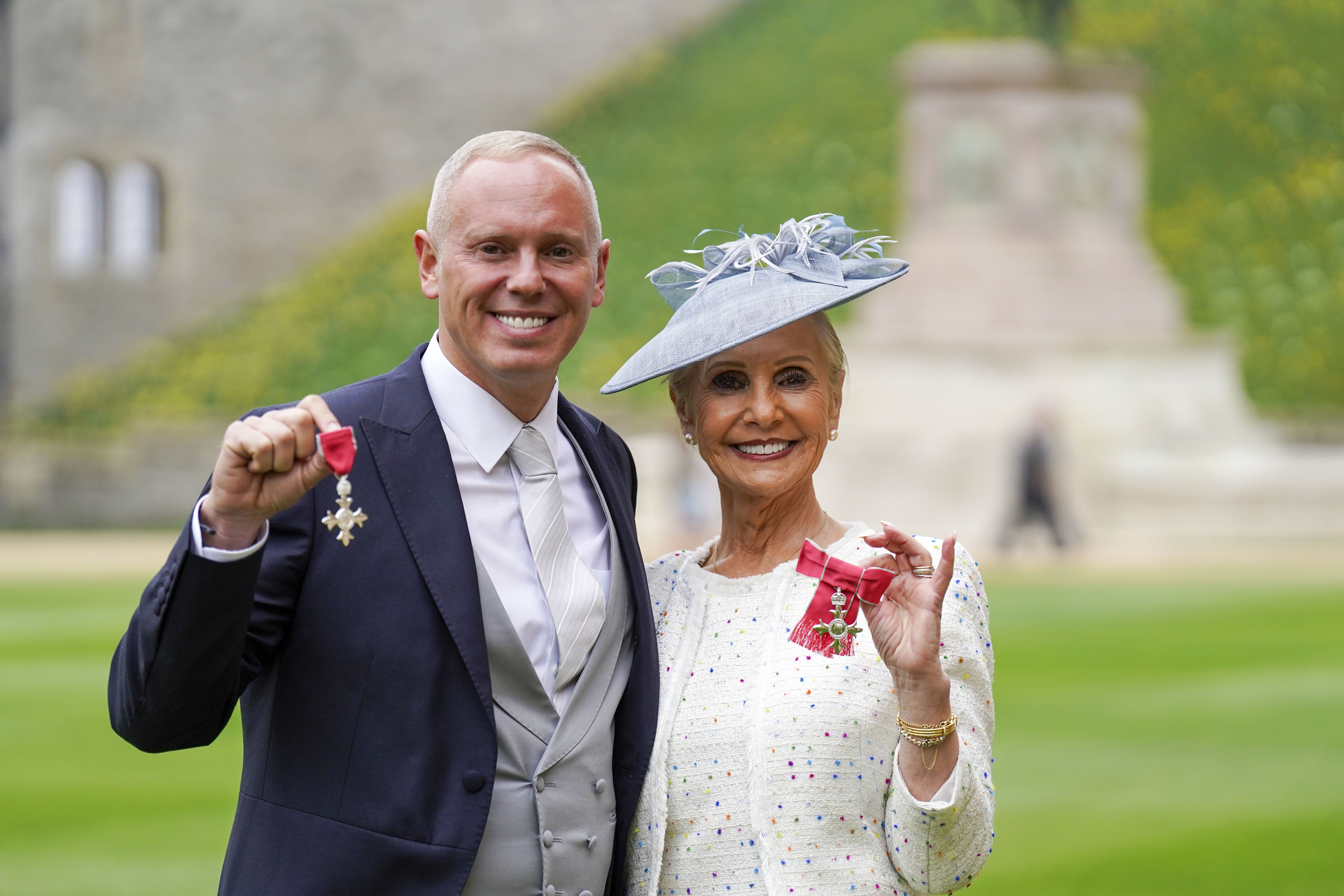 Robert Rinder and his mother Angela Cohen after receiving their MBE medals (Steve Parsons/PA)