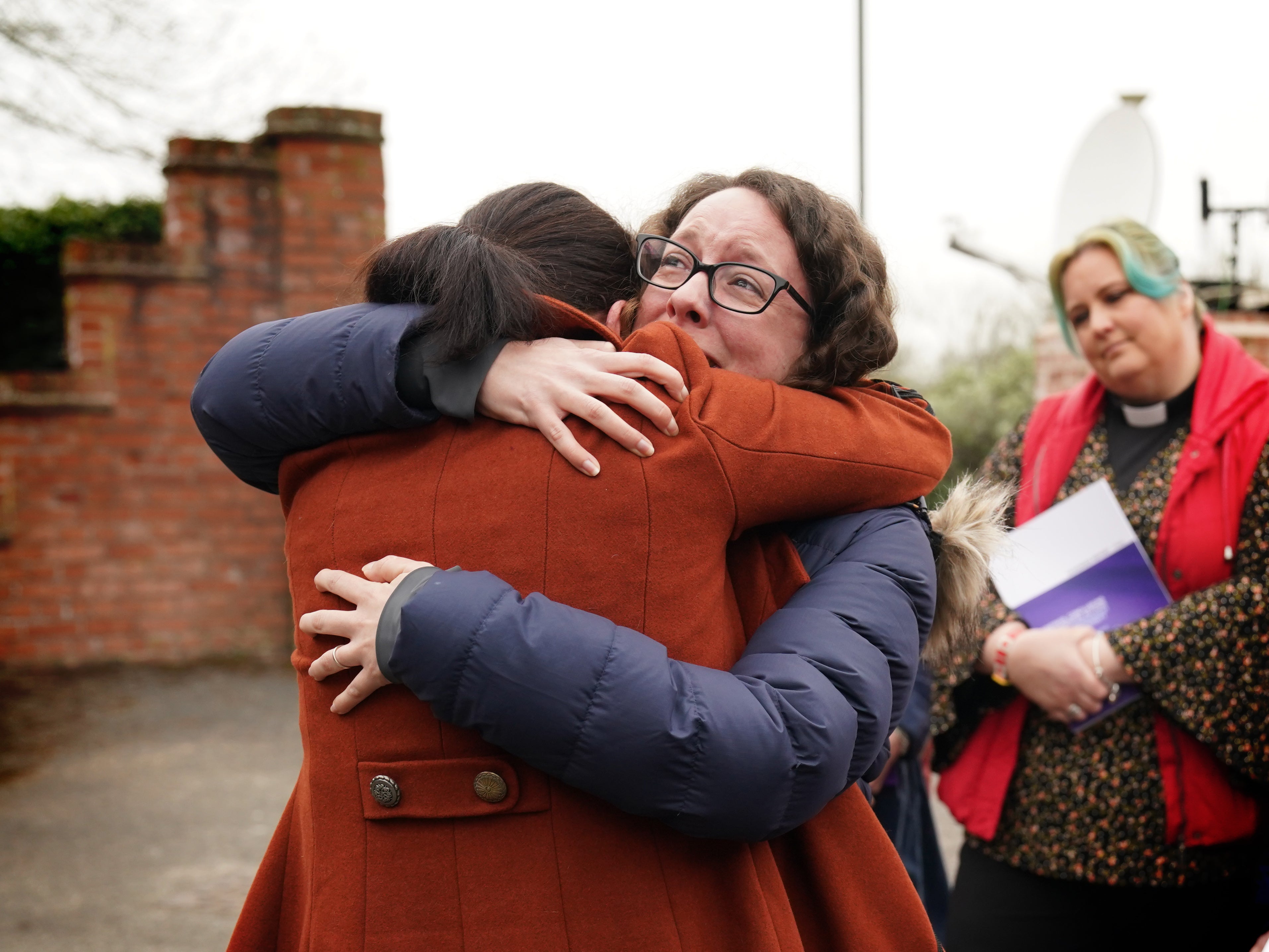 Rhiannon Davies (left) embraces Kayleigh Griffiths following the release of the final report by Donna Ockenden, chair of the Independent Review into Maternity Services at the Shrewsbury and Telford Hospital NHS Trust (PA)