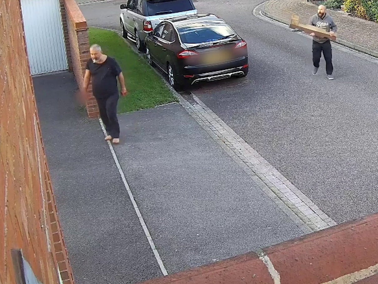 CCTV shown in court shows barefoot Can Arslan being confronted by an off duty police officer armed with a piece of wood after stabbing three neighbours