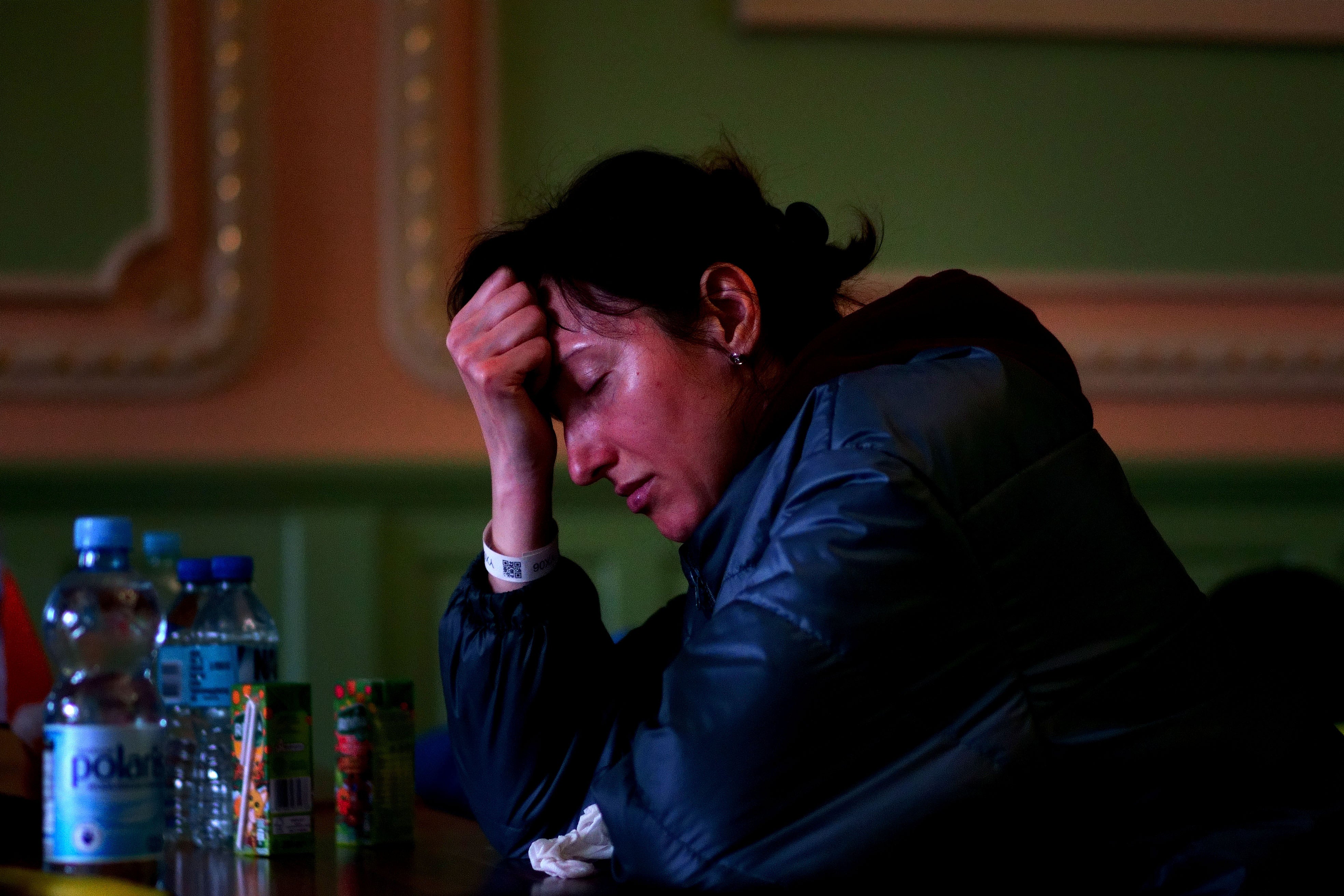 A Ukrainian refugee sits in a refuge room at Przemysl Glowny train station in Poland, after arriving by train from Ukraine to flee the Russian invasion. (Victoria Jones/PA)