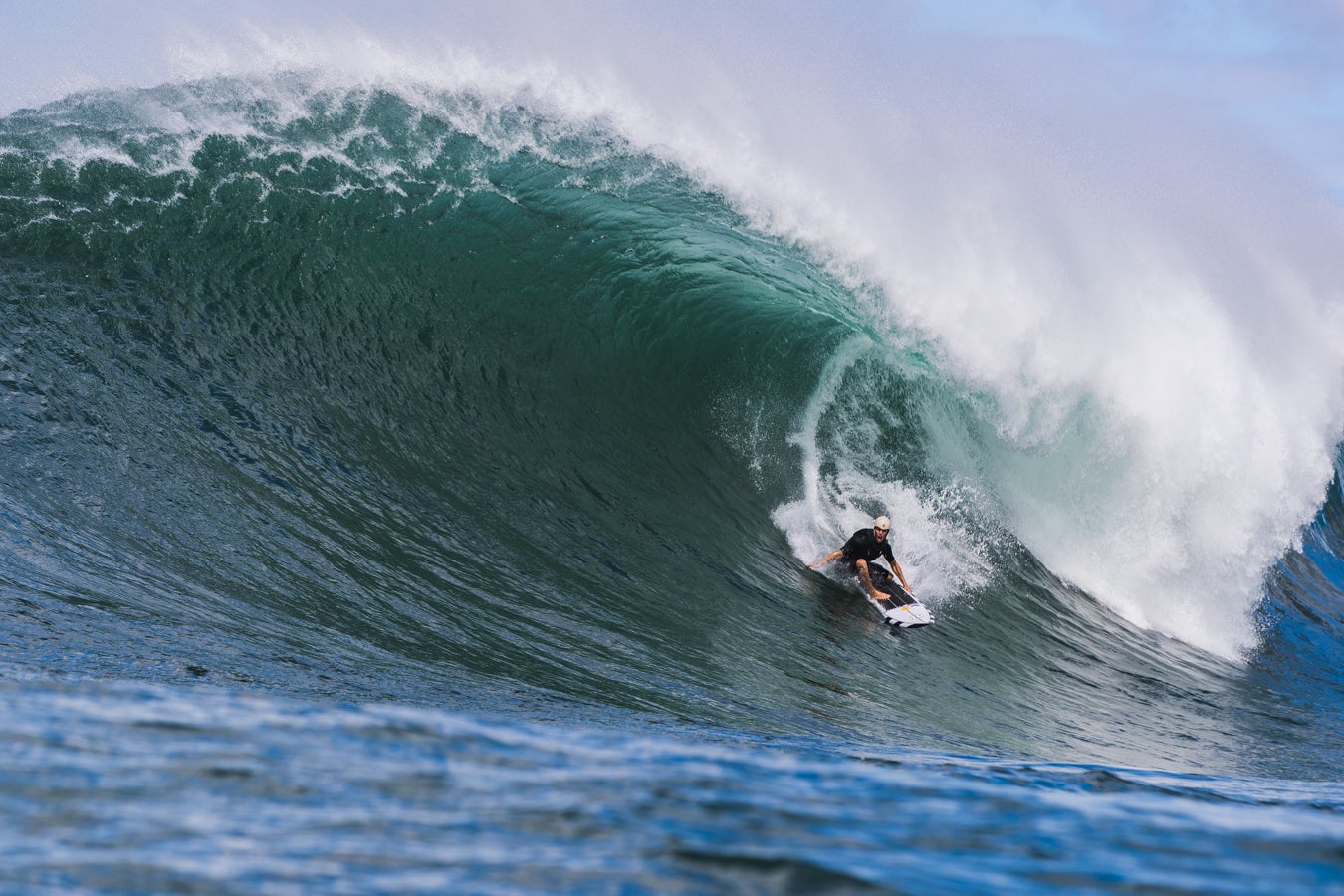 Koa Smith surfs Waimea Bay in the Hawaiian island of Oahu