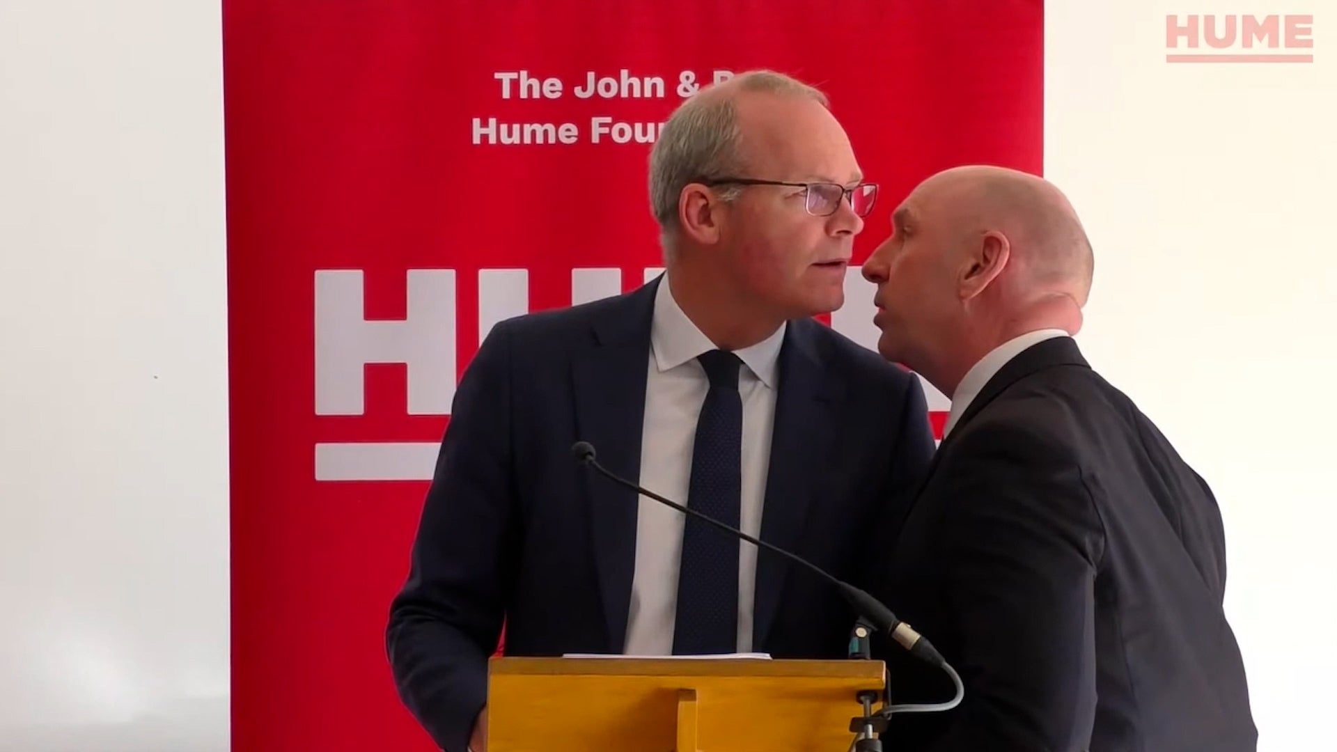 Screengrab taken from video issued by the Hume Foundation of Irish Foreign Affairs Minister, Simon Coveney, being ushered from the room due to a security alert whilst he was speaking at a peacebuilding event organised by the John and Pat Hume Foundation at The Houben Centre, Belfast (Hume Foundation/PA)