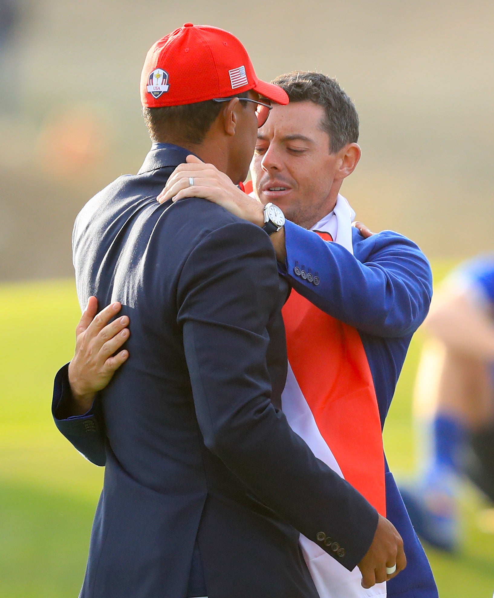 Tiger Woods and Rory McIlroy embrace following Europe’s Ryder Cup victory in Paris in 2018 (Gareth Fuller/PA)