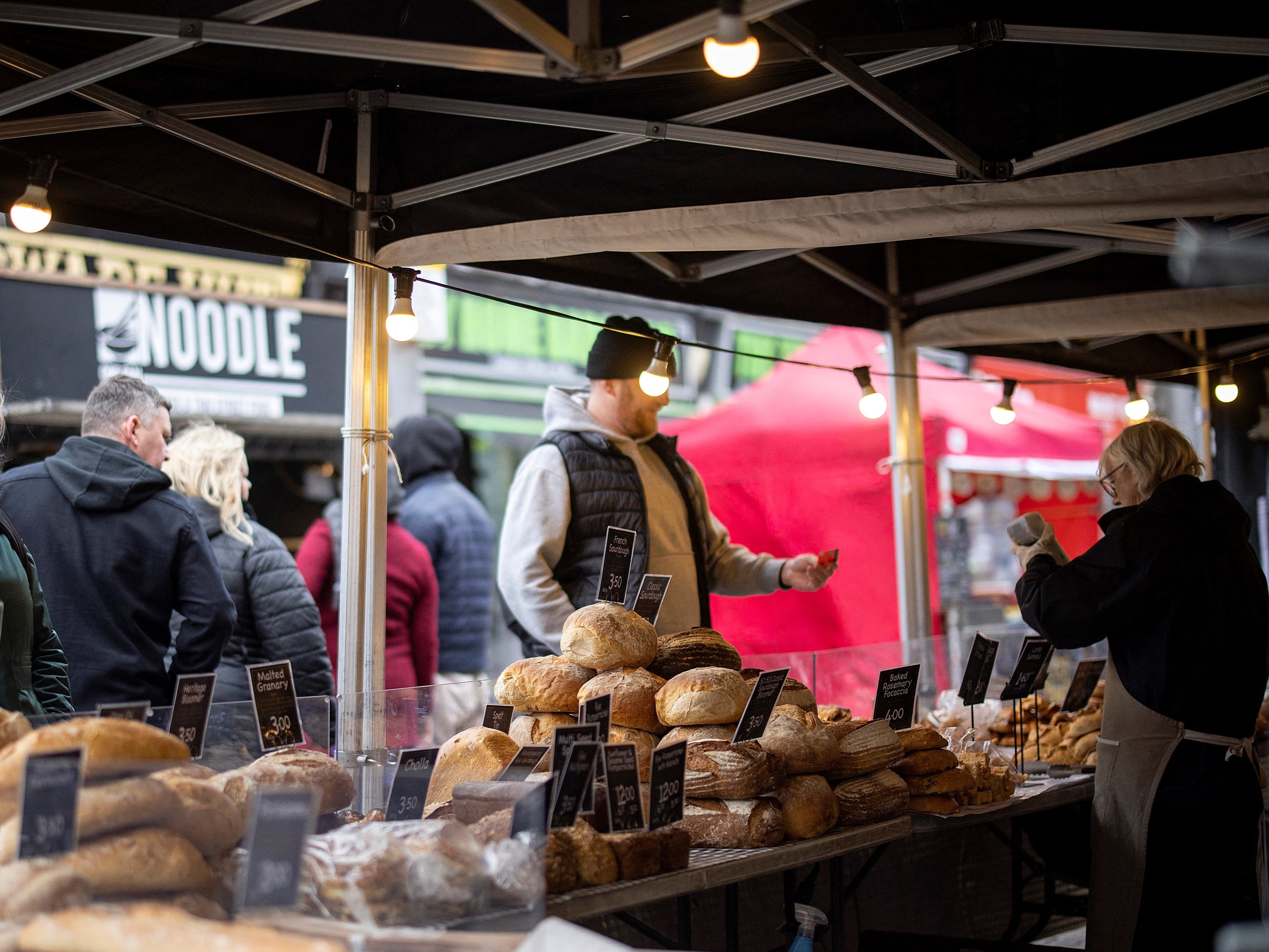 The UK economy grew at a faster pace than first thought in the final few months of last year, the ONS says