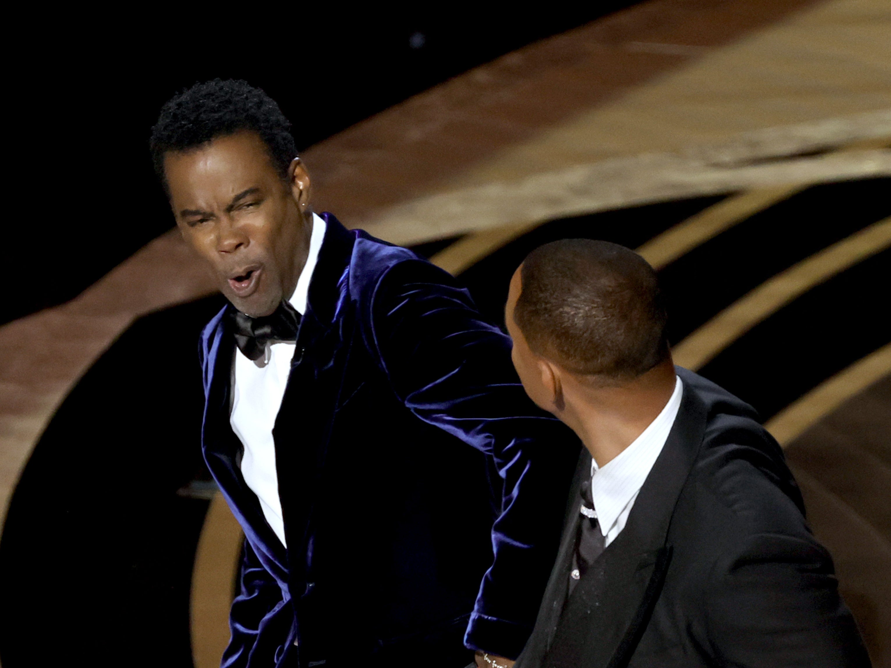 Rock and Smith on stage at the 2022 Oscars