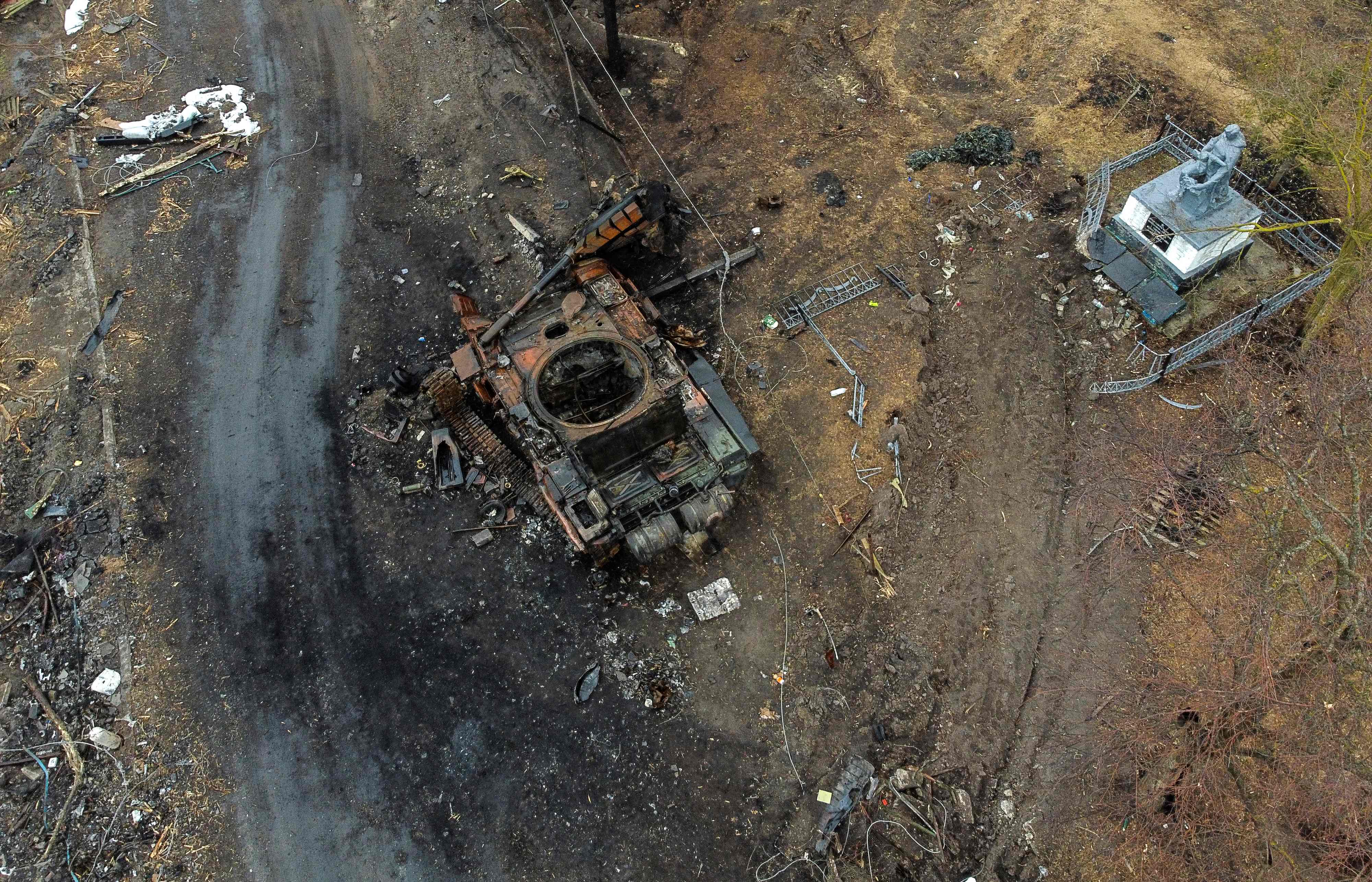 Aerial view taken near Kyiv on 30 March shows a destroyed Russian tank in the village of Lukianivka