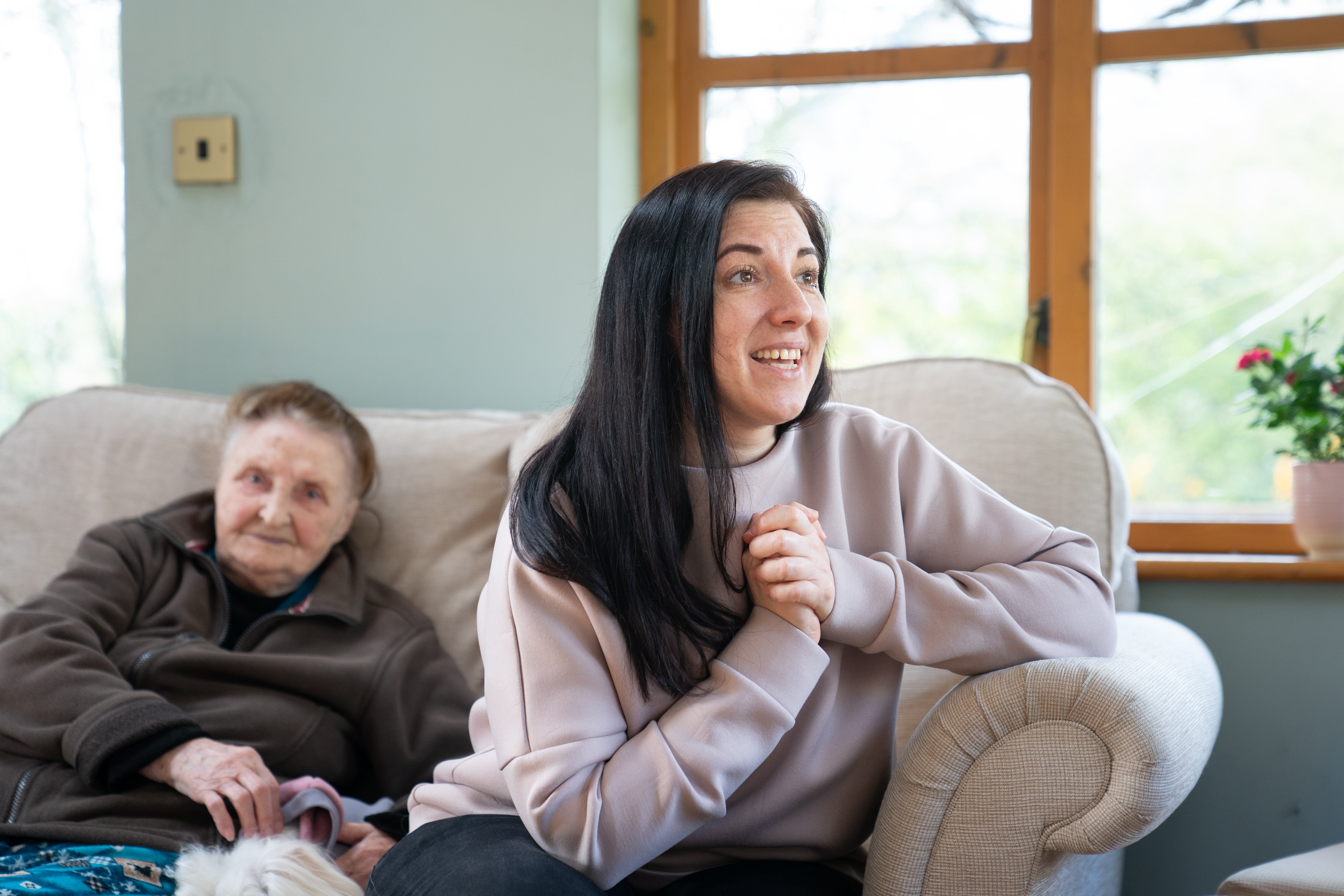 Valeriia Starkova and her grandmother Ludmila, 90, settle into their new home in Caldecote, near Cambridge (Joe Giddens/PA)