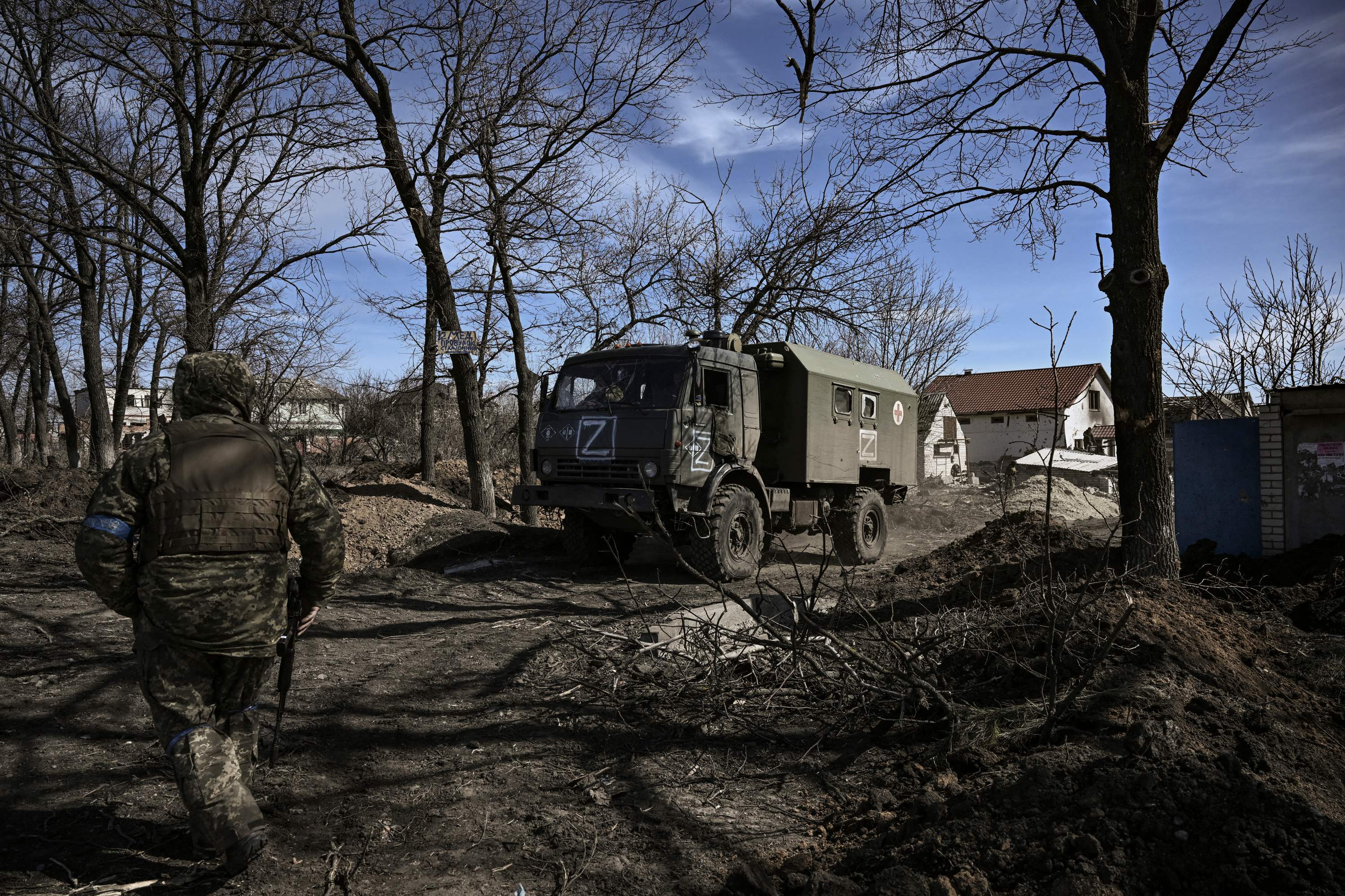 Ukranian troops drive a captured Russian military vehicle after retaking the village of Mala Rohan, east of Kharkiv