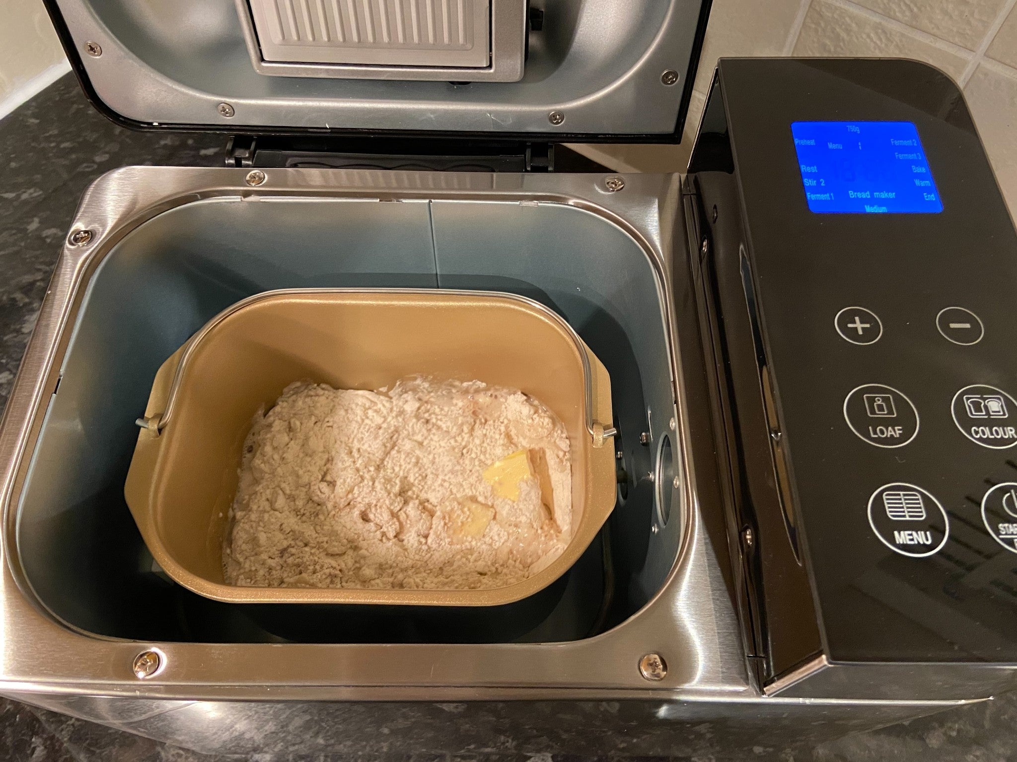 The seed tray in the underside of the lid flips open at a preset time for nuts and fruit