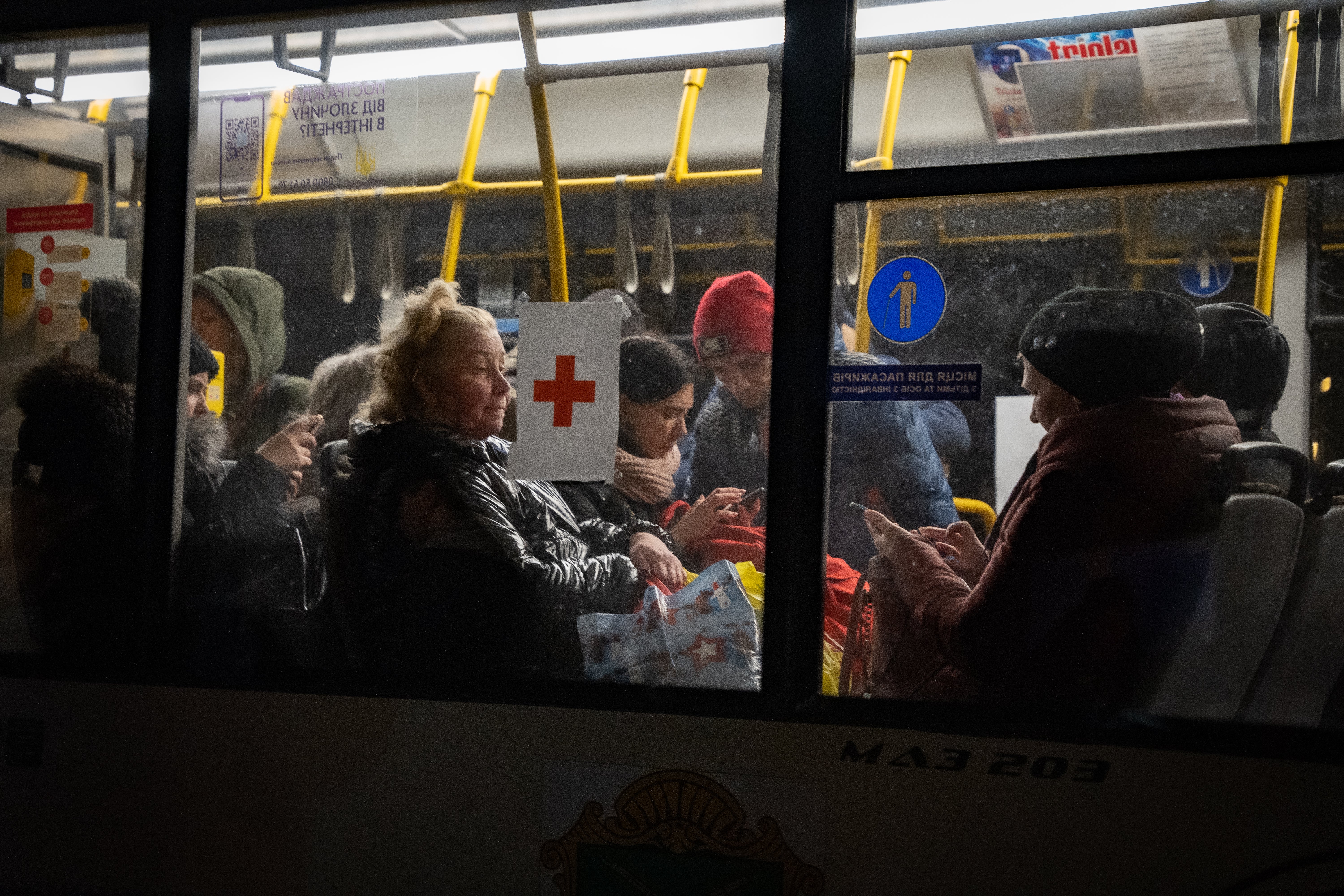 Civilians who have managed to make it out of Mariupol by their own cars or on foot arrive at a reception centre in Zaporizhzhia