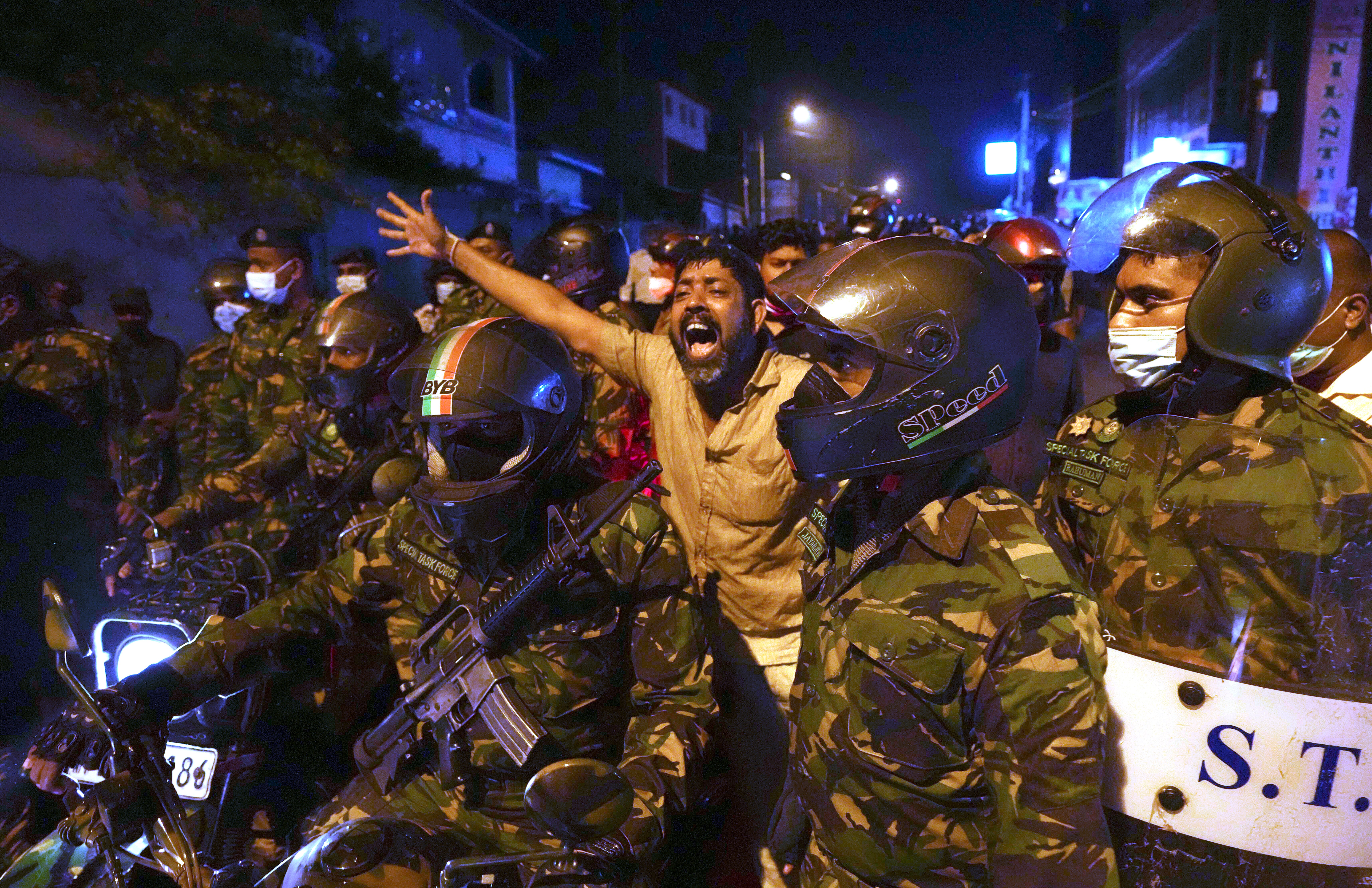 A Sri Lankan man shouts anti-government slogans during a protest outside the president’s private residence on the outskirts of Colombo