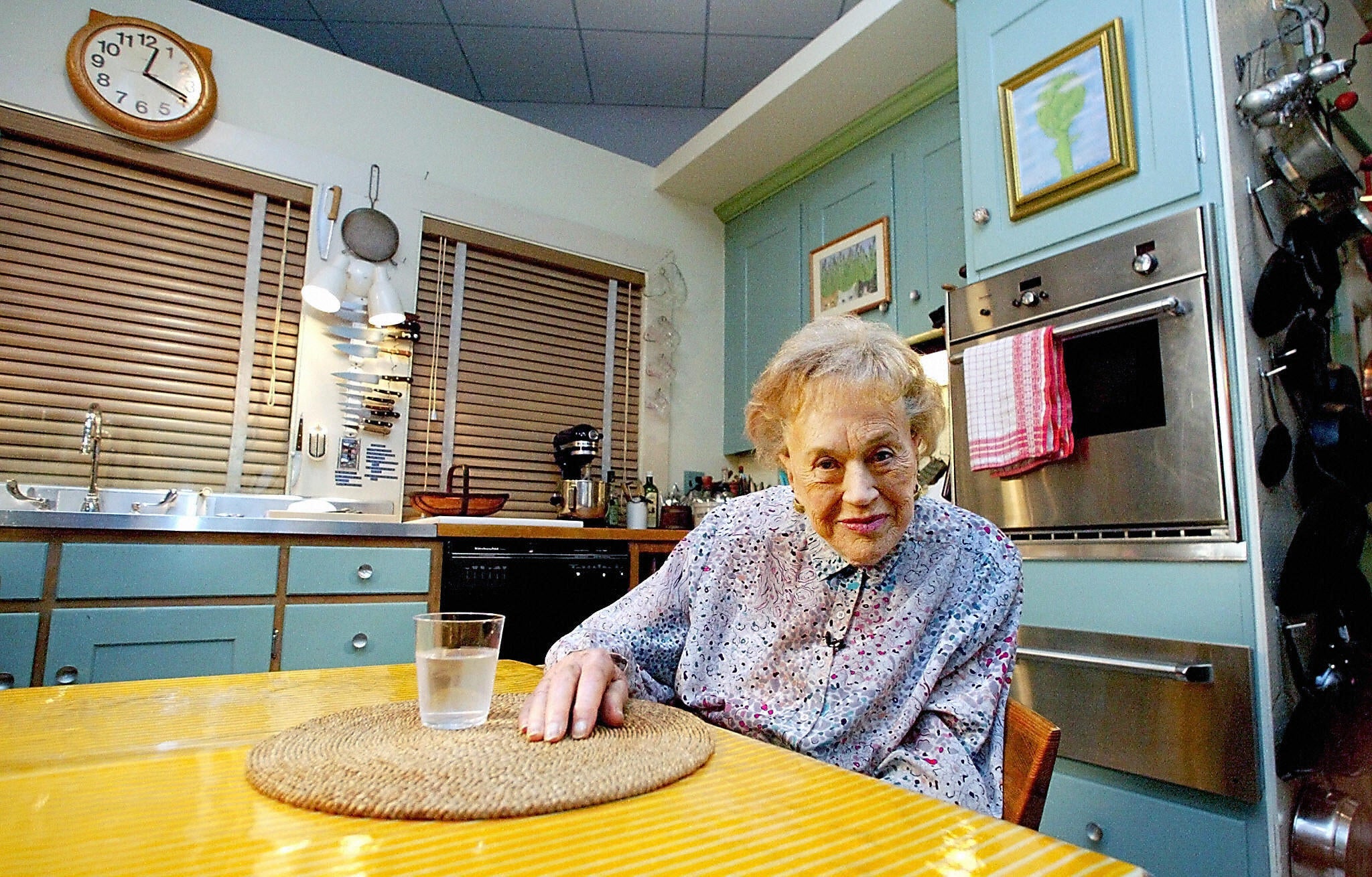 Julia Child sitting in her kitchen at the National Museum of American History in Washington, DC on 19 August 2002