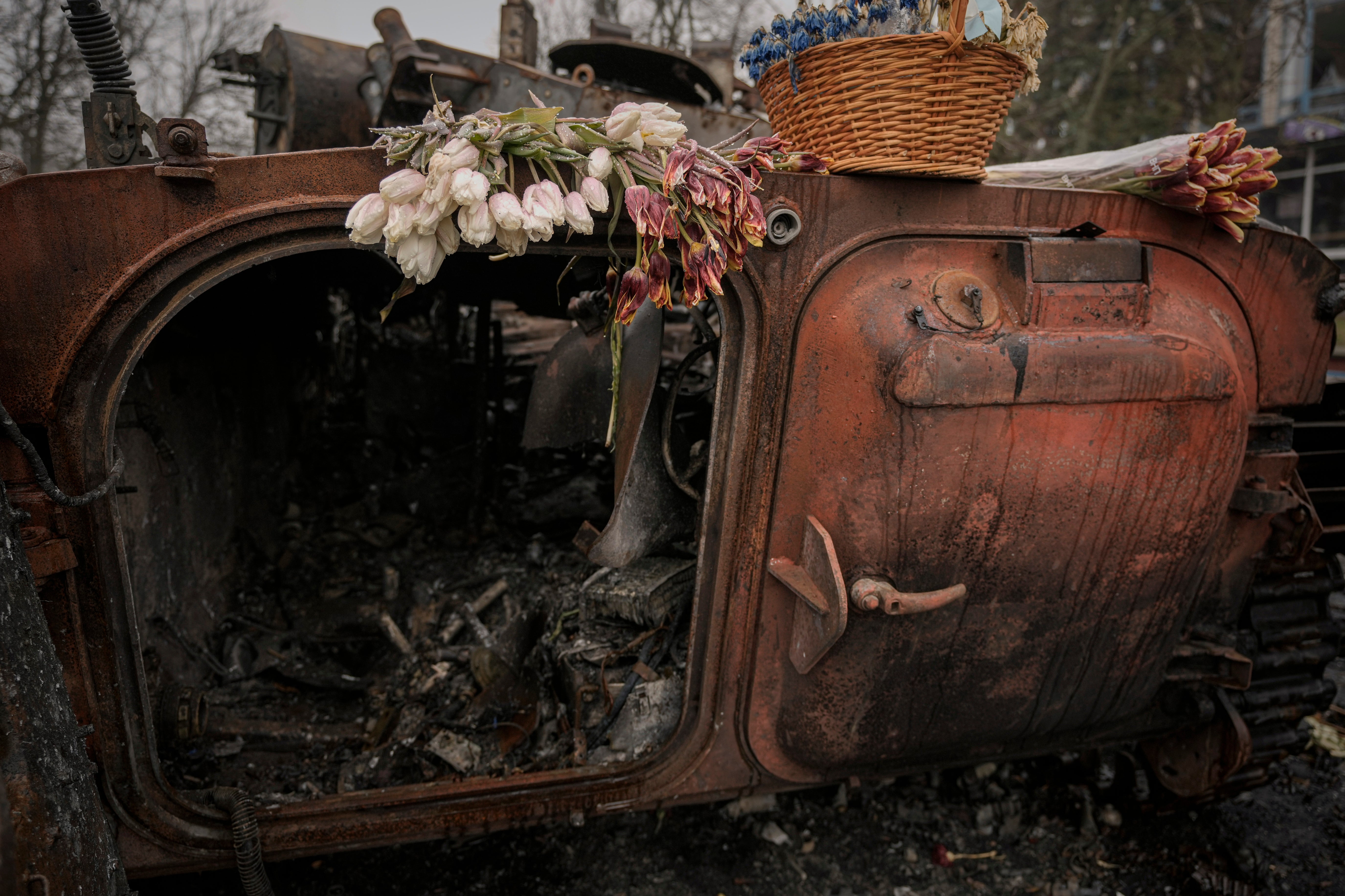 Flowers are placed on a Ukrainian military armored fighting vehicle destroyed during fighting between Russian and Ukrainian forces outside Kyiv on Friday 1 April 2022