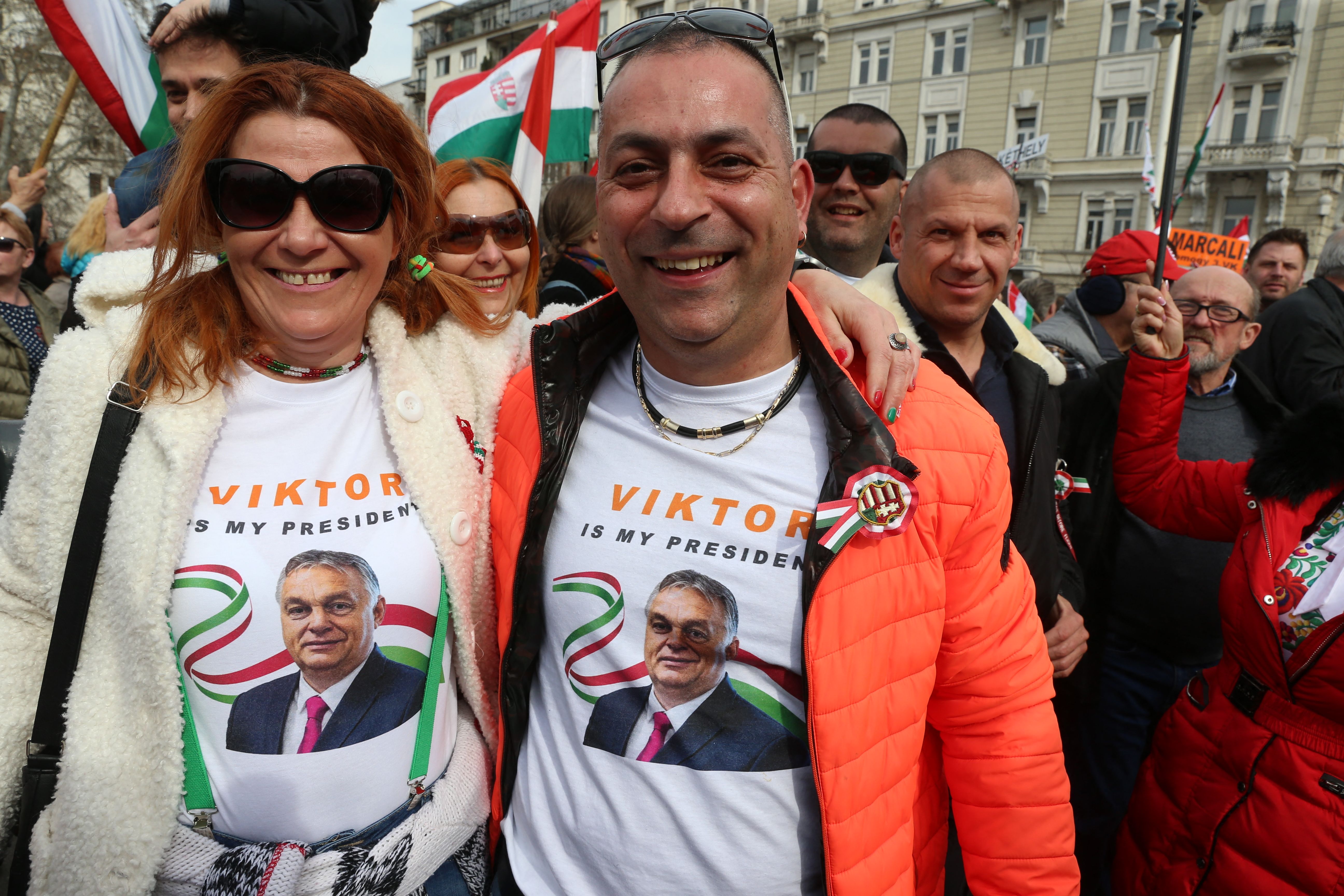 People supporting Mr Orban take part in a so-called “Peace March” in Budapest, 15 March 2022