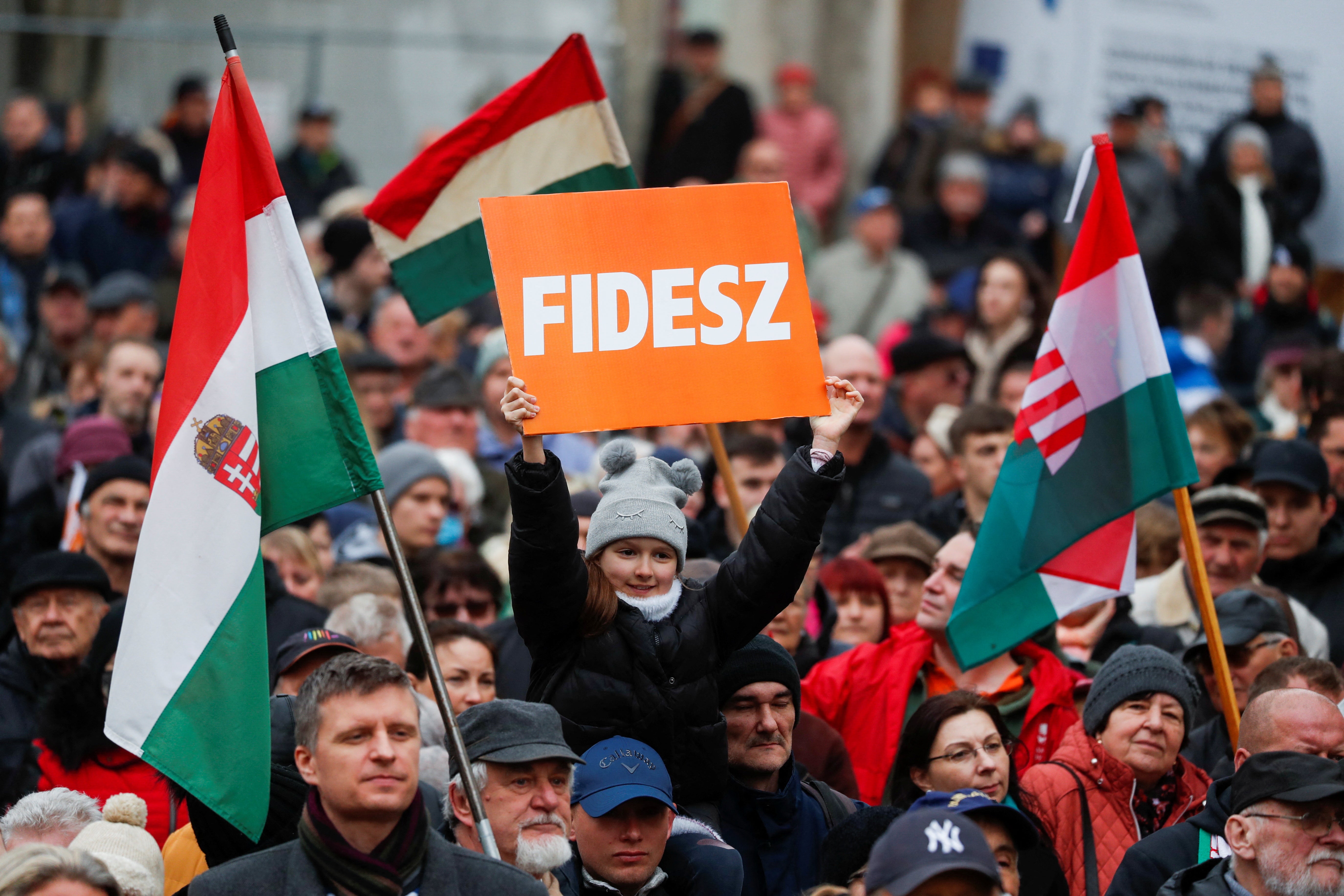 Orban supporters cheer during the closing campaign session of the Fidesz party in Szekesfehervar on Friday