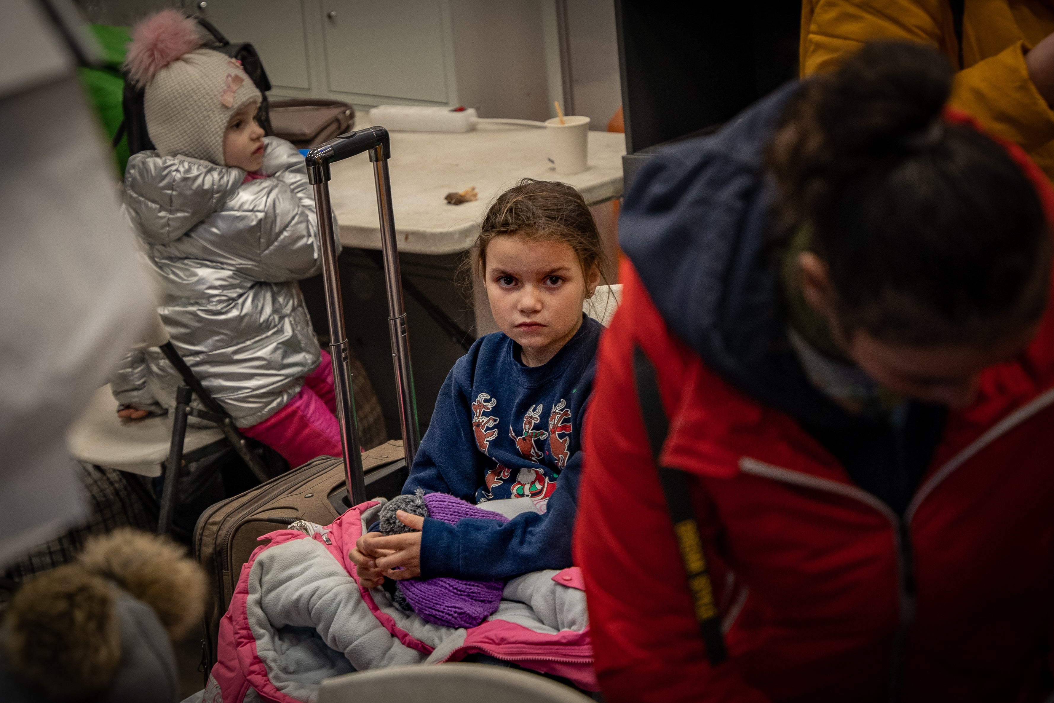 Children arrive at a reception centre in Zaporizhzhia in the middle of the night after a dangerous journey from Mariupol