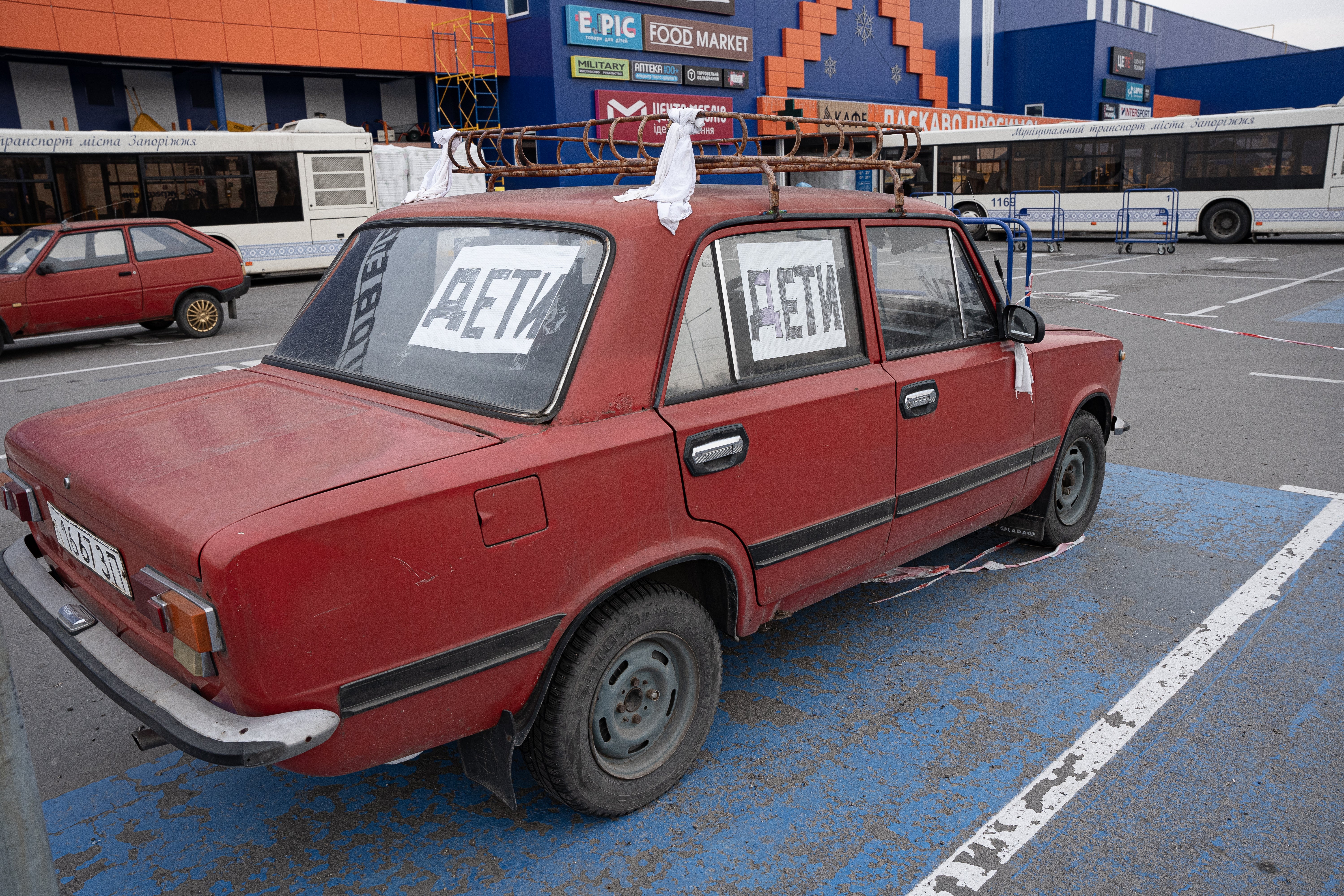 Civilians tie white rags and write ‘children’ in Russian on their cars in the hope that soldiers do not target them