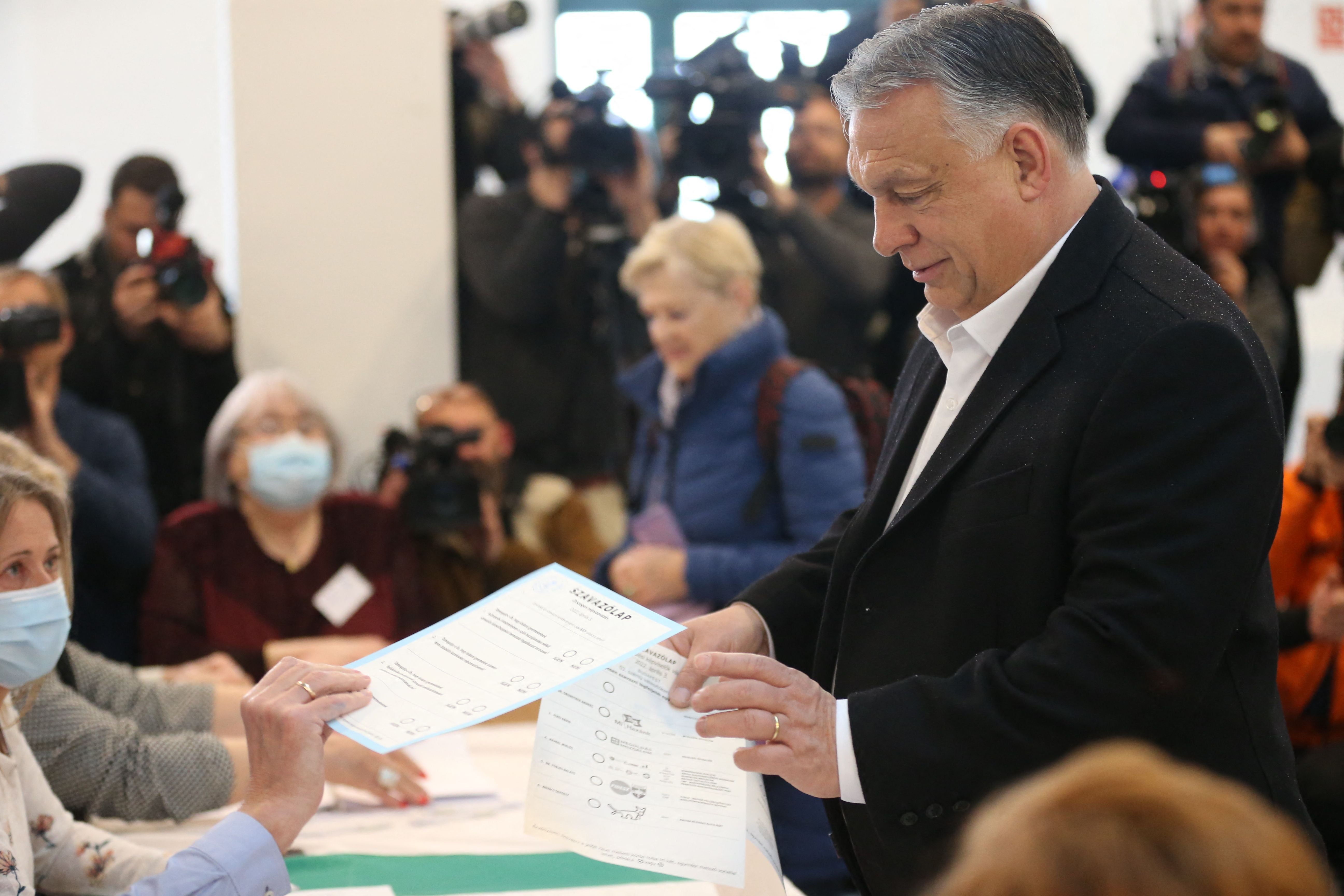 Hungarian prime minister Viktor Orban prepares to cast his ballot during the elections at a polling station in Budapest, 3 April 2022