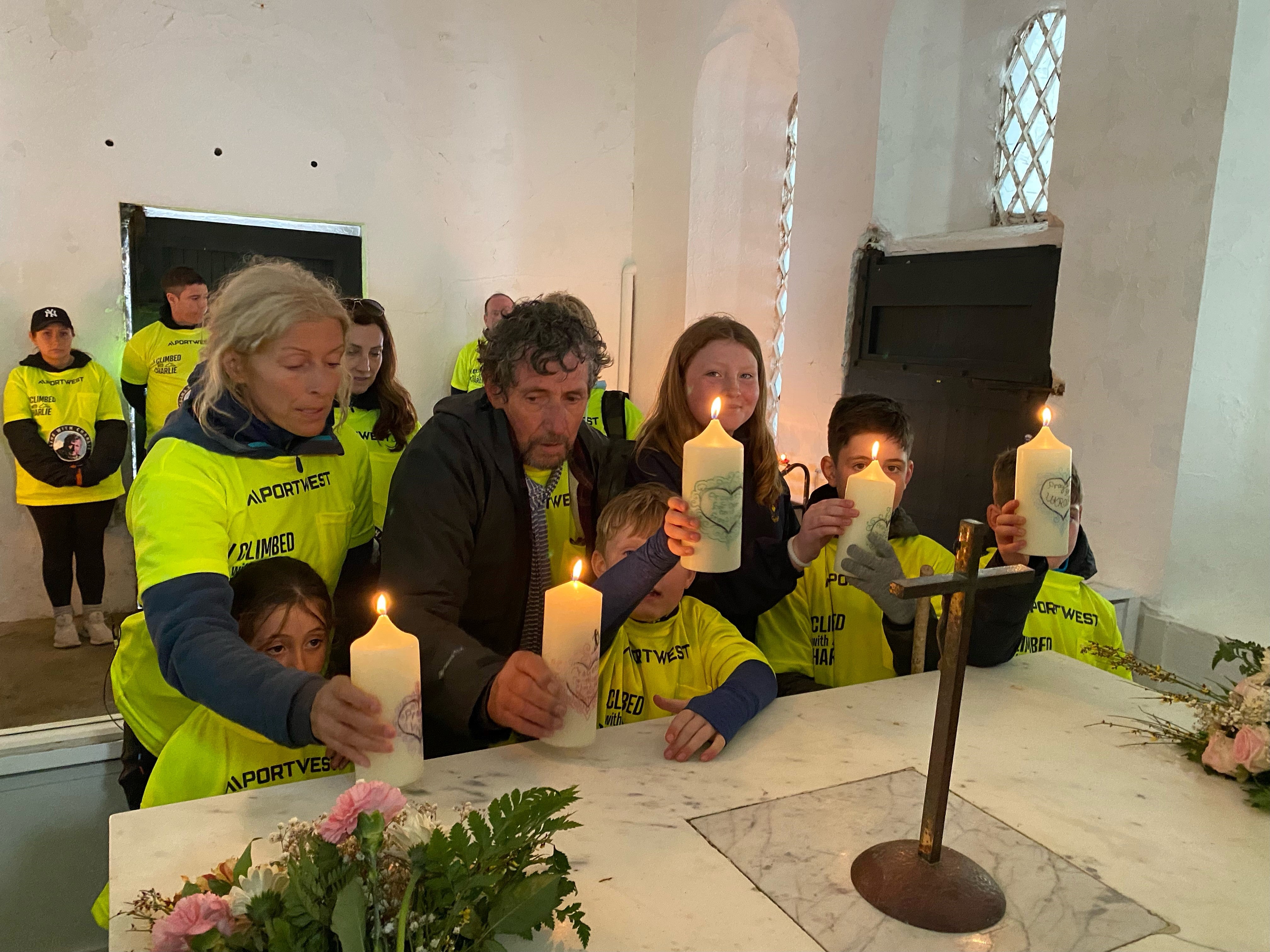 Charlie Bird lights candles in the chapel at the top of Croagh Patrick (Paul Allen and Associates/PA)