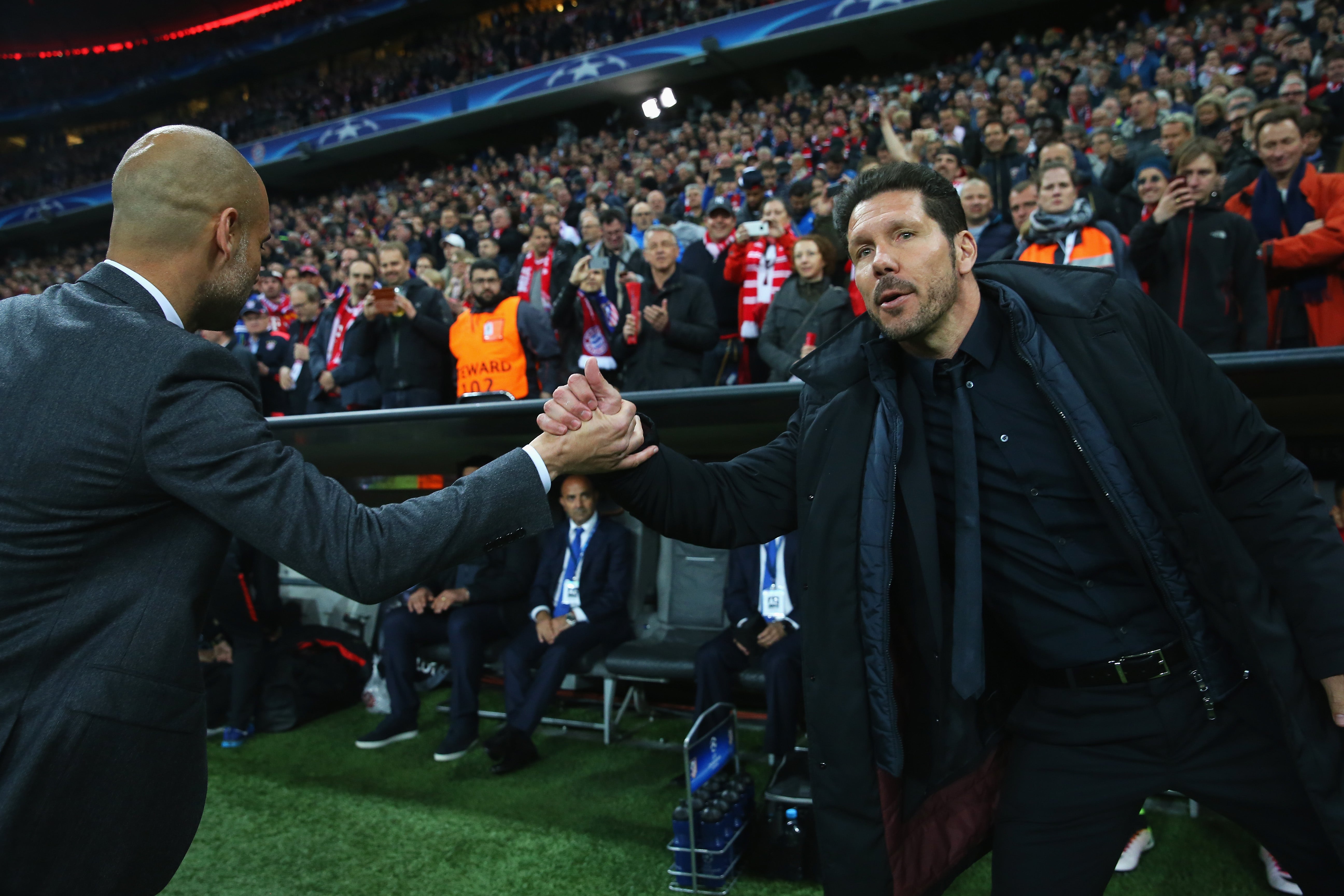 Guardiola and Simeone shake hands before kick-off in Munich