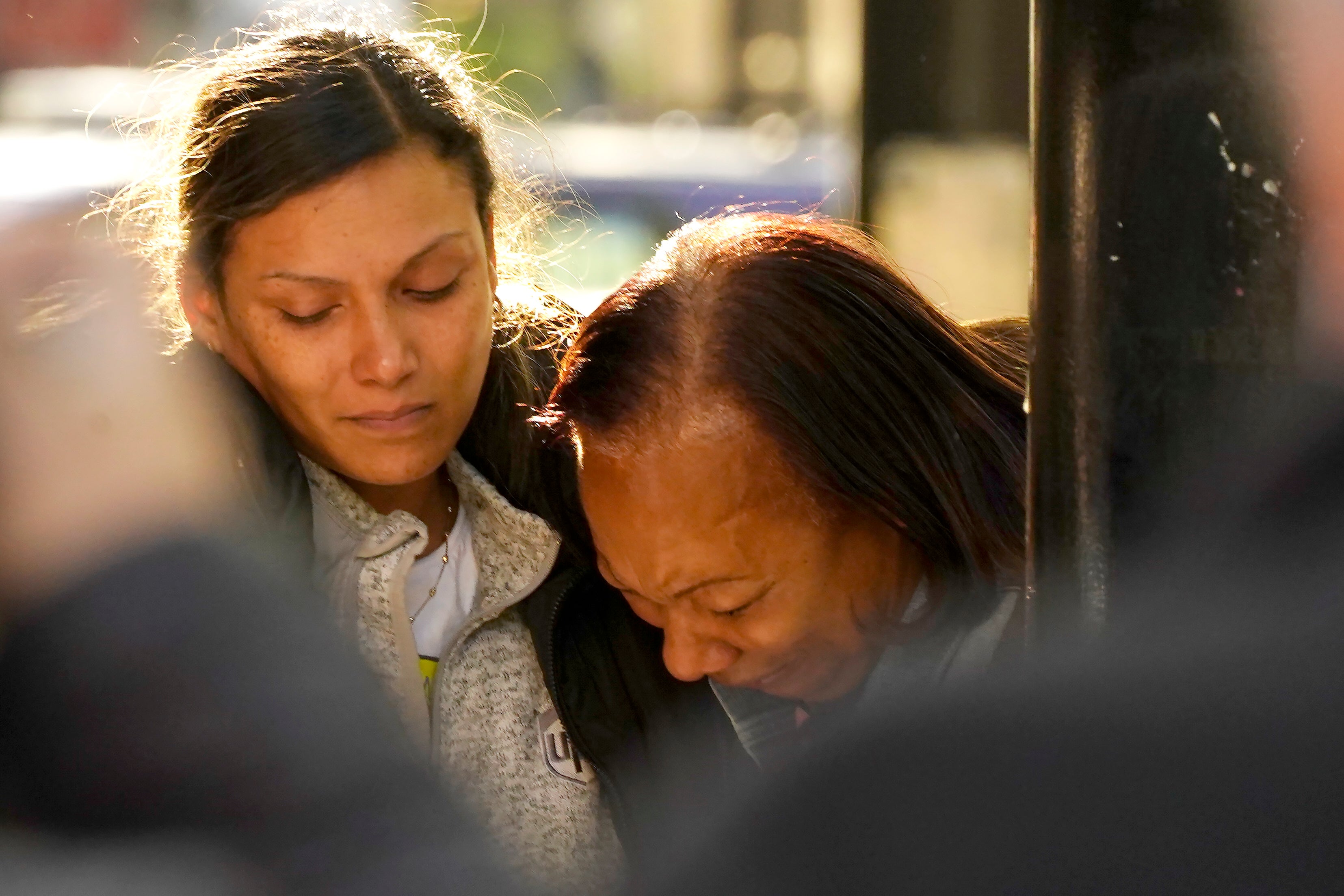 Leticia Harris, left, the wife of mass shooting victim Sergio Harris, consoles his mother, Pamela Harris after receiving the news of his death In Sacramento, Calif. April 3, 2022