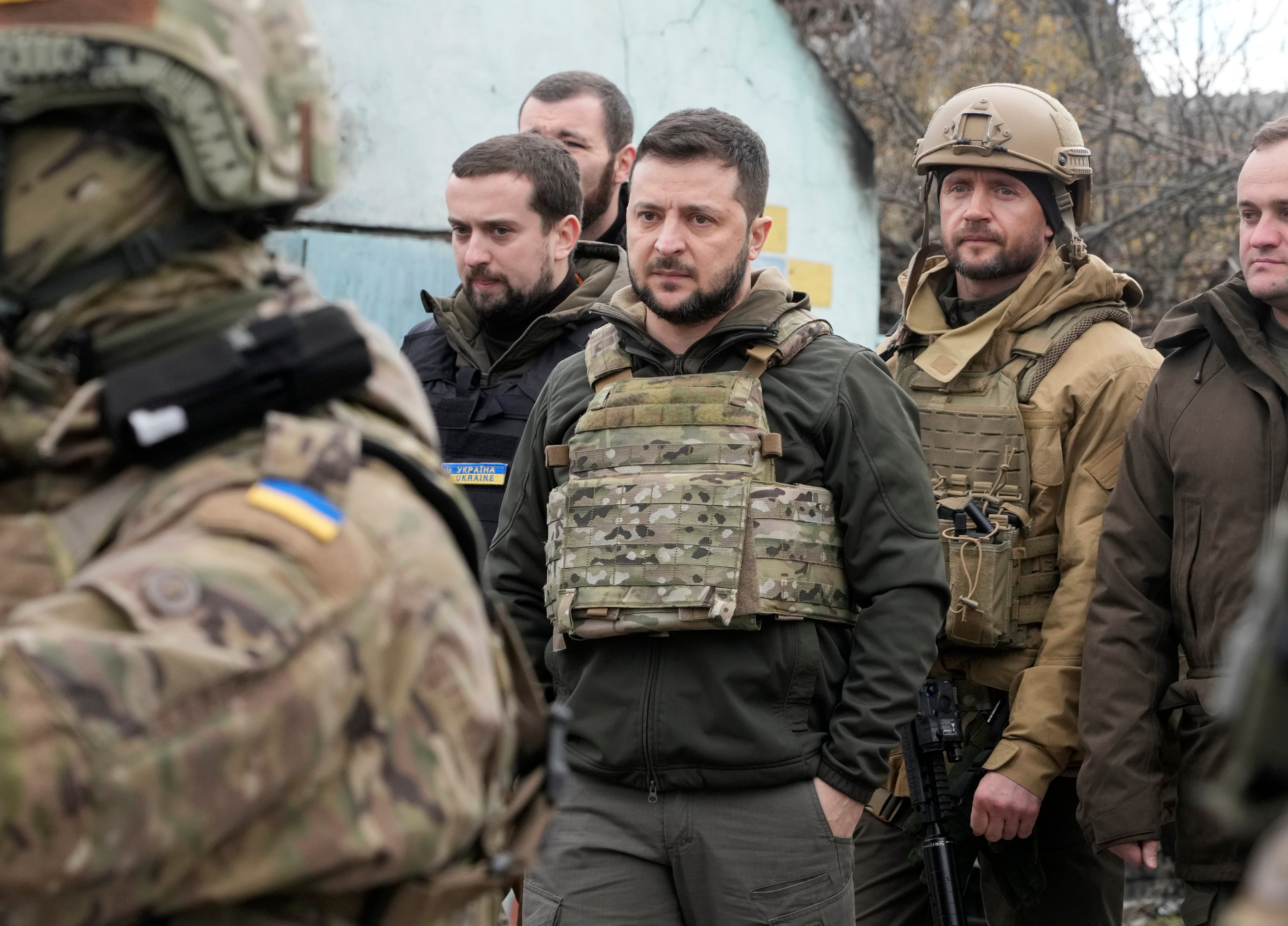 Ukrainian President Volodymyr Zelenskyy examines the site of a recent battle in Bucha (Efrem Lukatsky/AP)