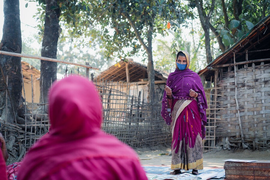 Hason Ara leads a discussion with the group of women farmers she formed, reminding them of the importance of saving, investing and not giving up