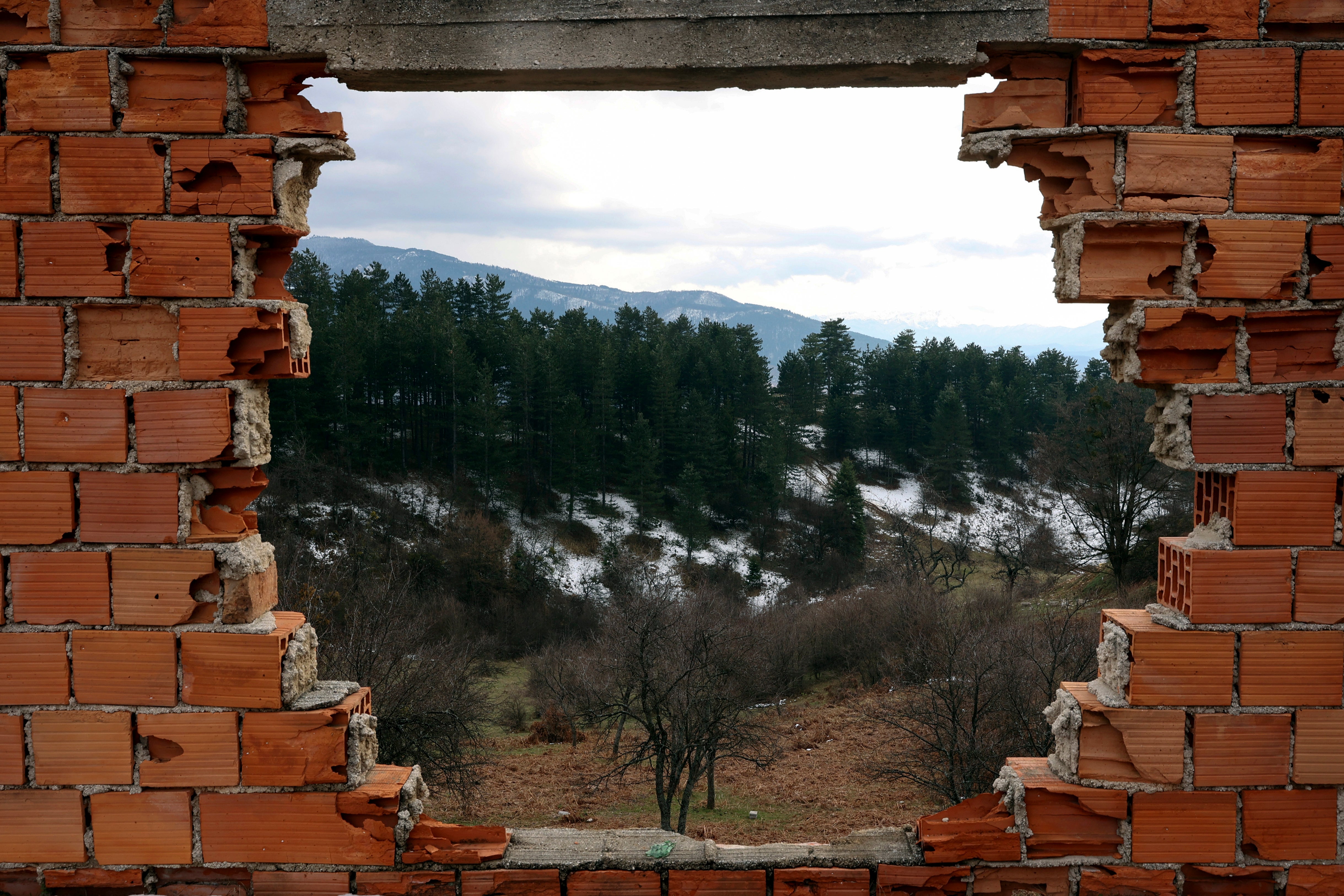 A view of a former front-line from a ruined house from 1992-1995 war is seen in Sarajevo, Bosnia, Monday, April 4, 2022