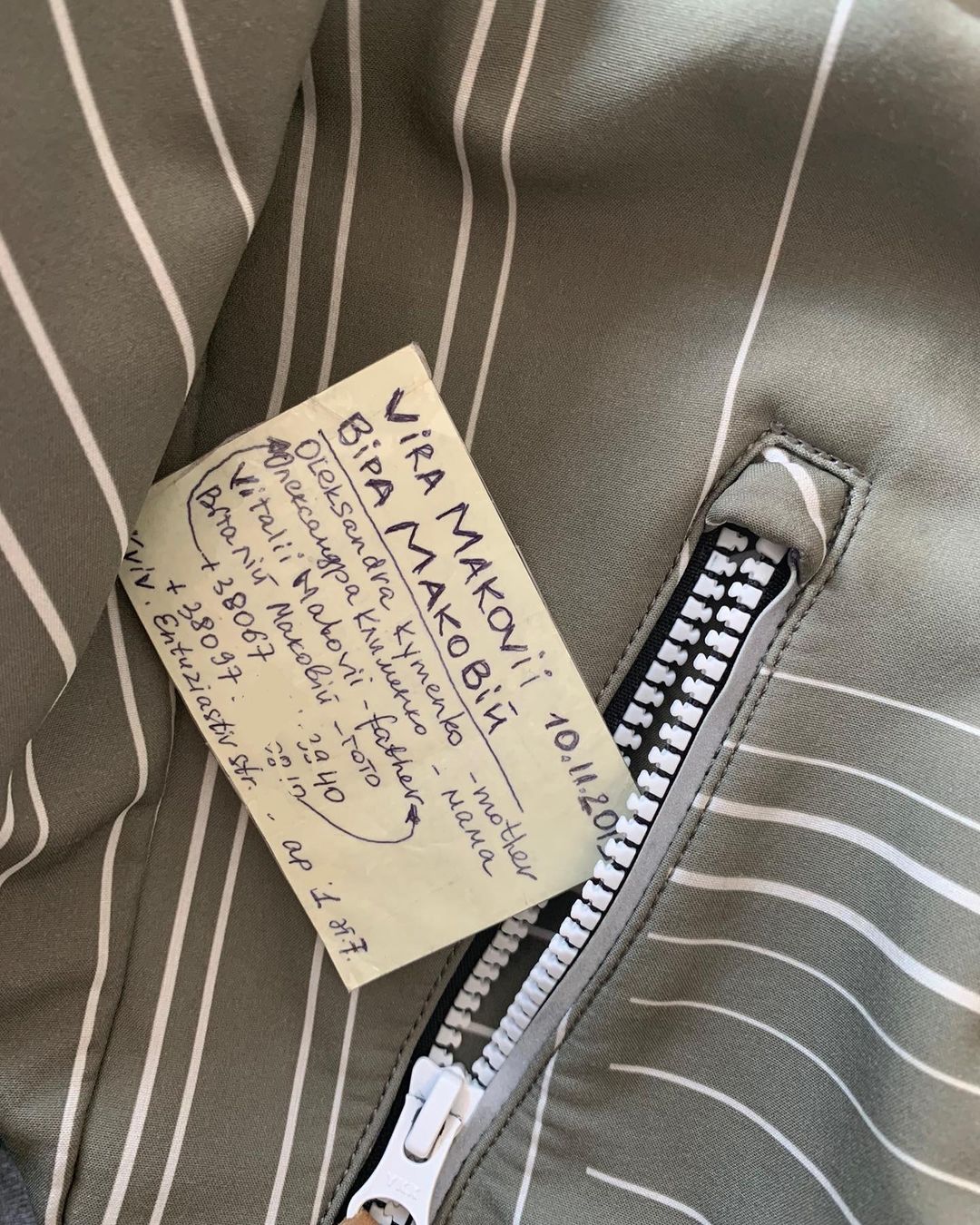 Sasha shared a second image of a hand-written contact card placed in her daughter’s jacket, showing the details of her parents