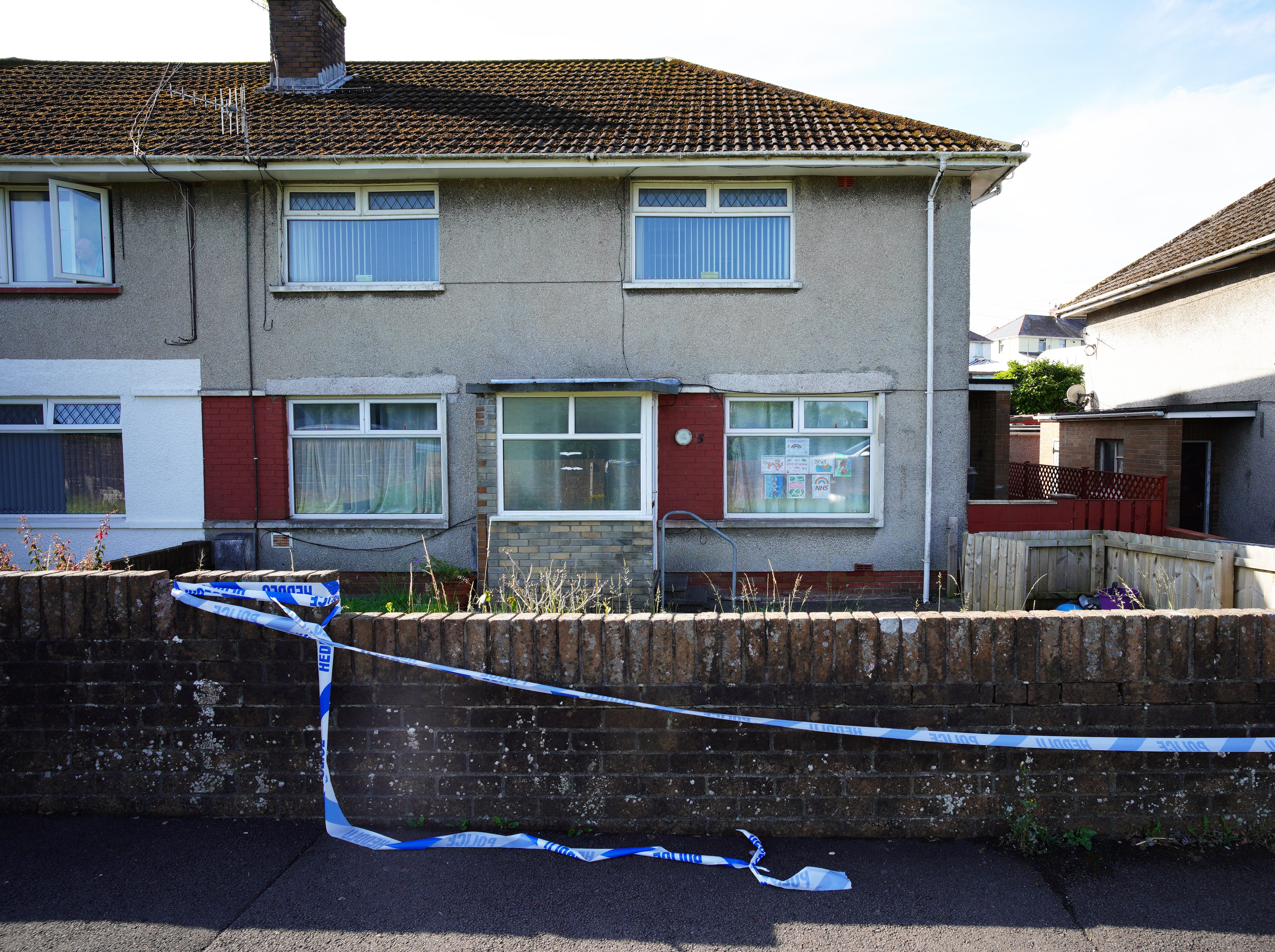 Police tape at a property in the Sarn area of Bridgend, near where five-year-old Logan Mwangi was found dead in the River Ogmore