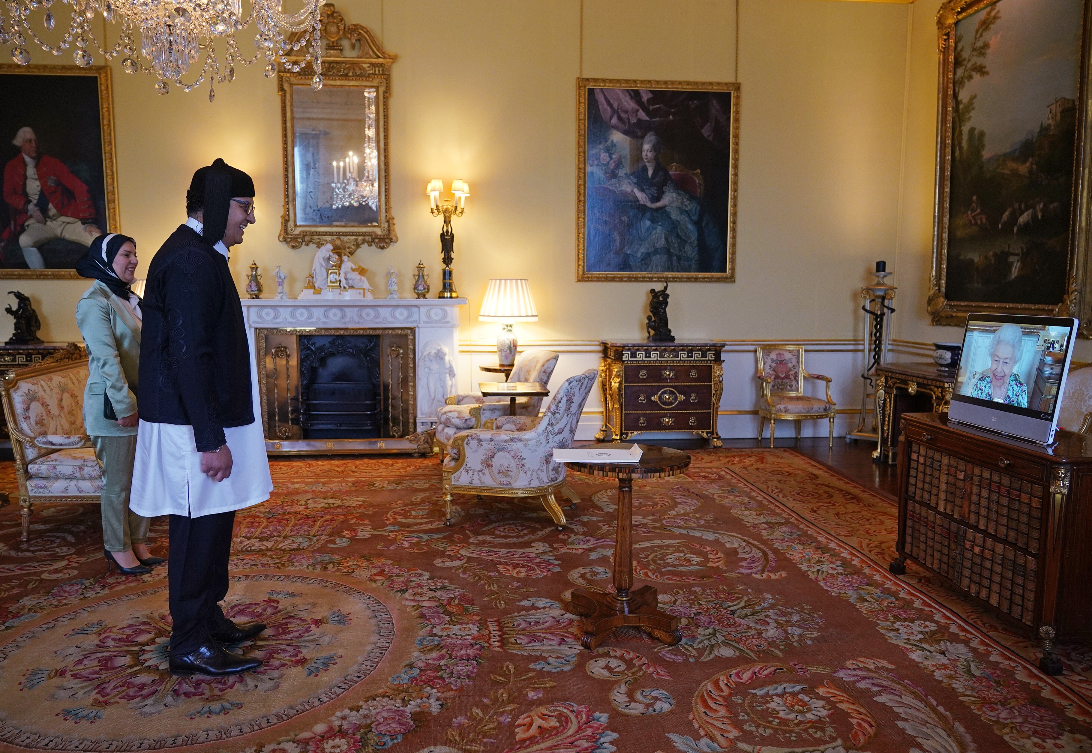 The Queen appears on screen during a virtual audience with Libyan Ambassador Salah Mrehil and his wife, Hanaa Gbasa (Yui Mok/PA)