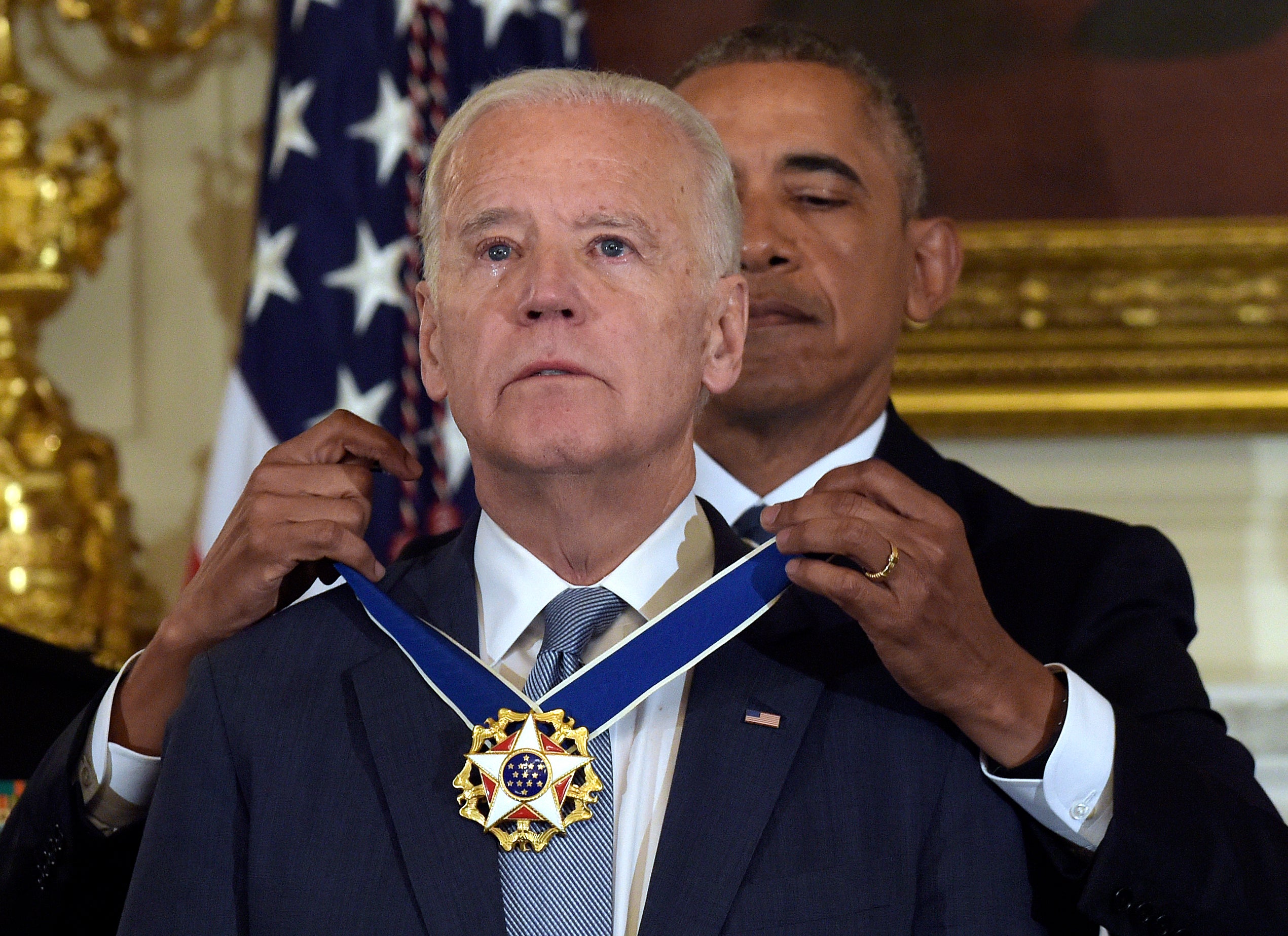 President Barack Obama presents vice-president Joe Biden with the Presidential Medal of Freedom during a ceremony in the State Dining Room of the White House in Washington, 12 January 2017